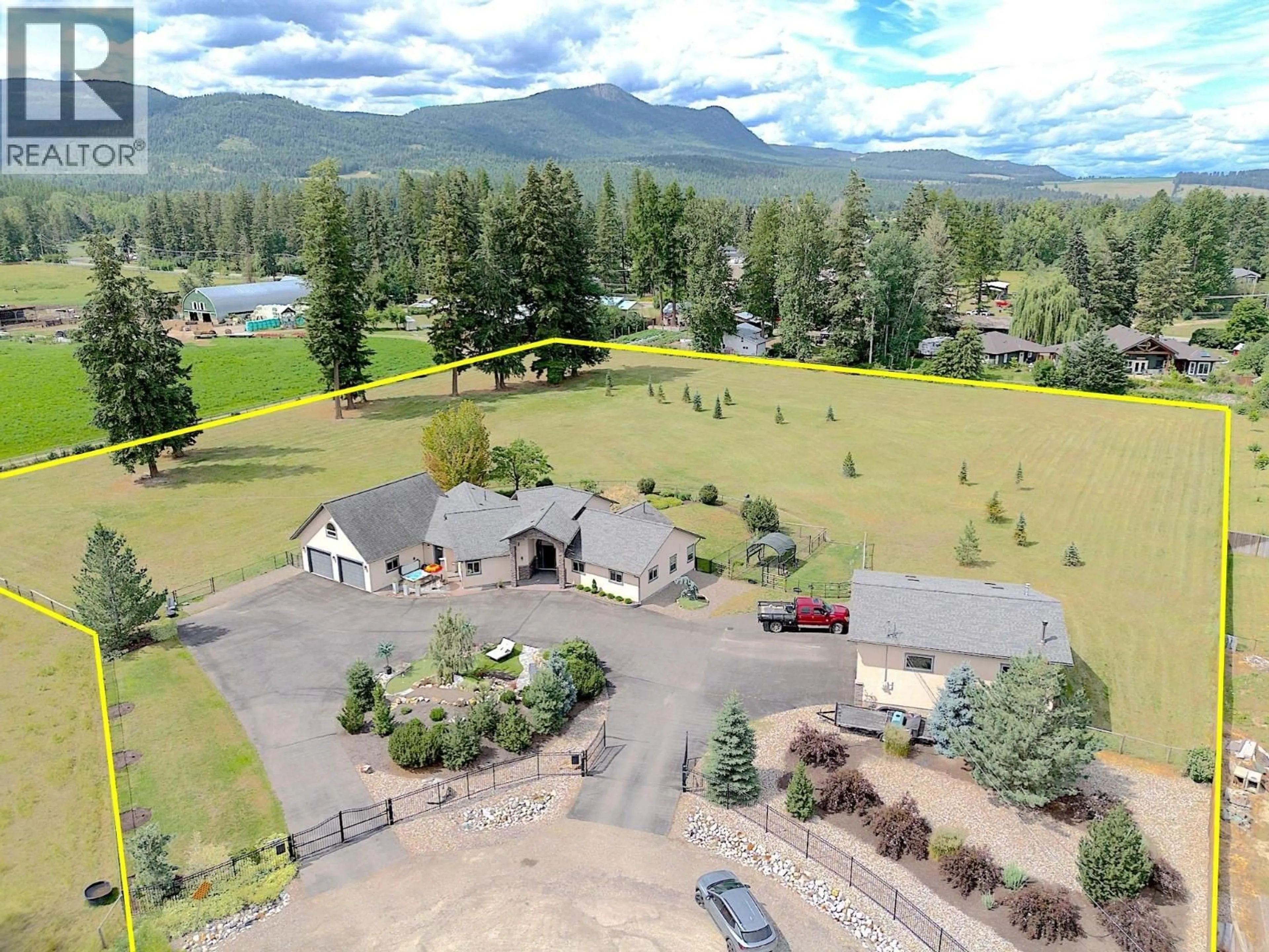 A pic from outside/outdoor area/front of a property/back of a property/a pic from drone, mountain view for 384 KYRO ROAD, Lumby British Columbia V0E2G7