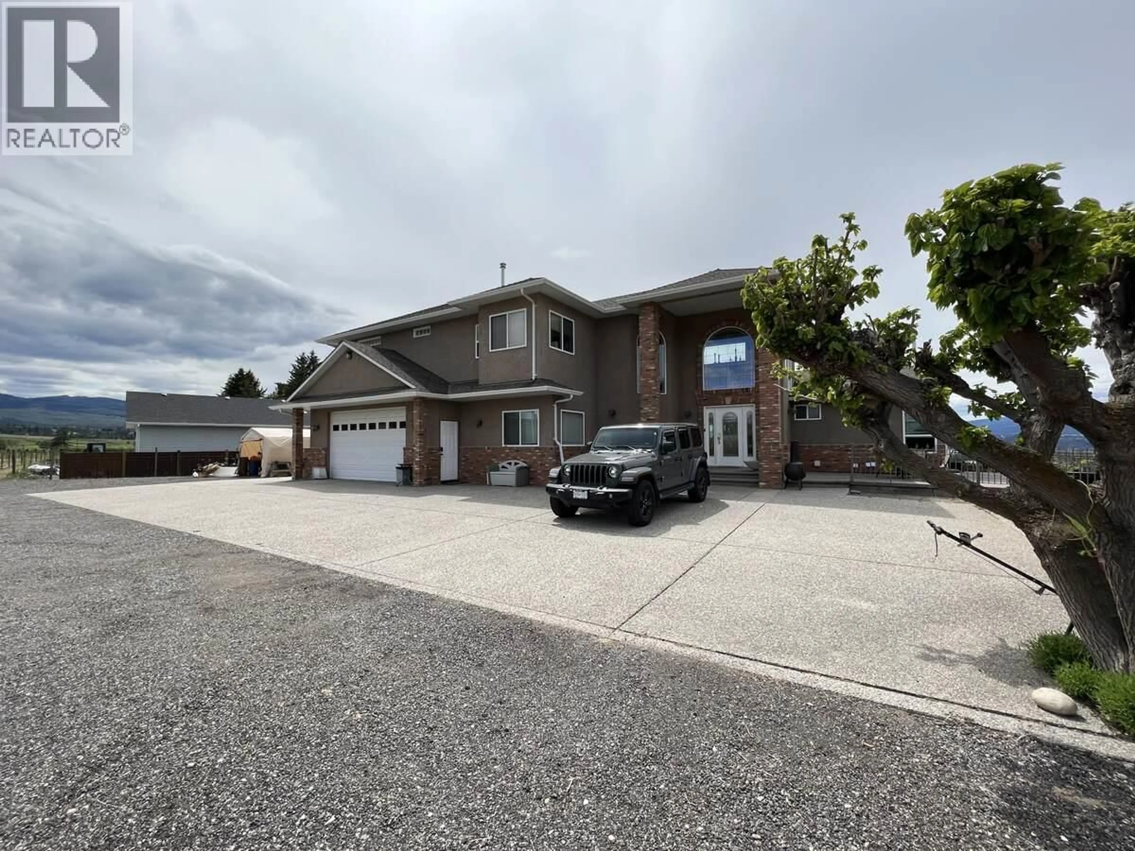 A pic from outside/outdoor area/front of a property/back of a property/a pic from drone, street for 3380 NEID ROAD, Kelowna British Columbia V1W4H5
