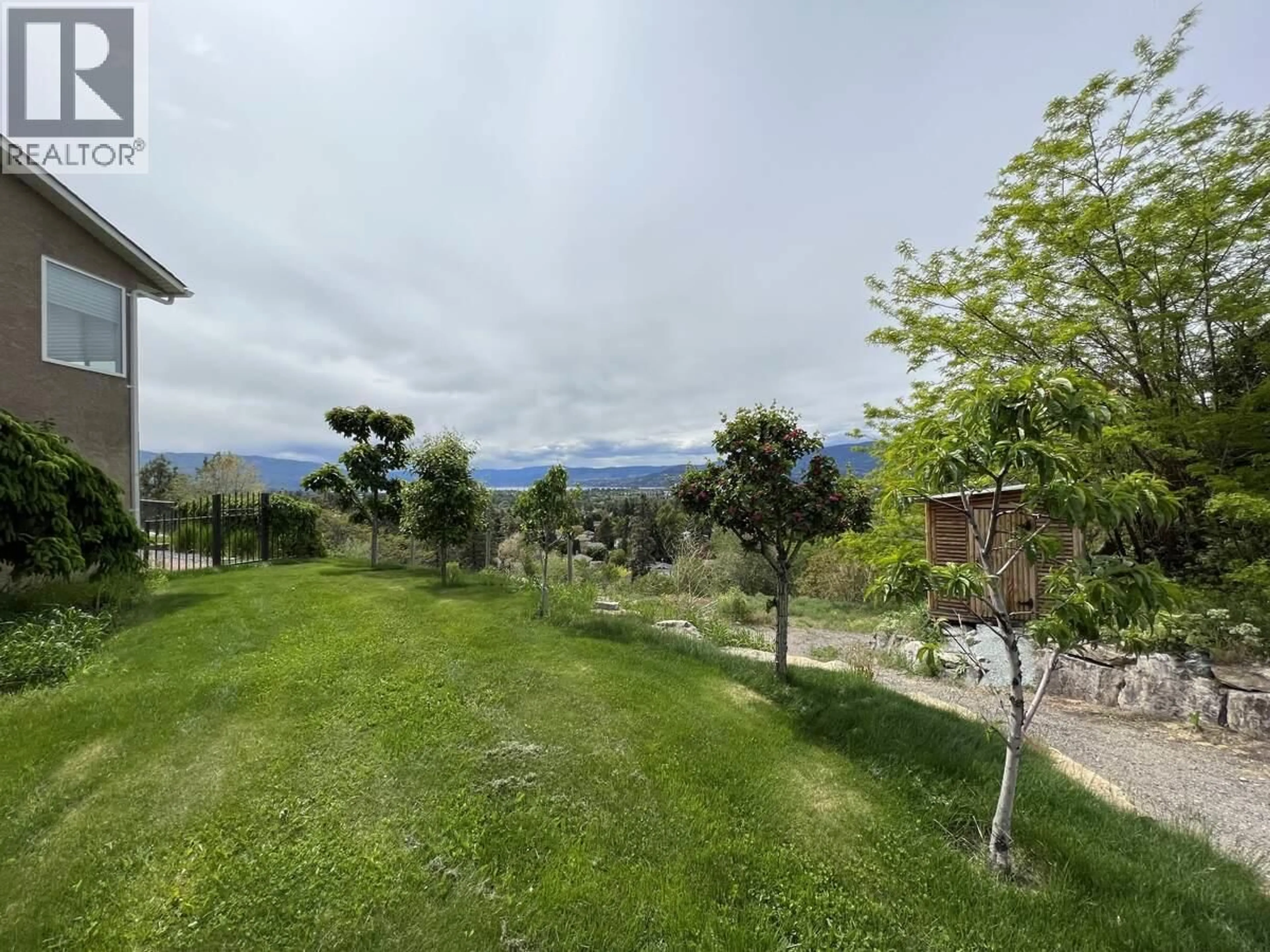 A pic from outside/outdoor area/front of a property/back of a property/a pic from drone, mountain view for 3380 NEID ROAD, Kelowna British Columbia V1W4H5