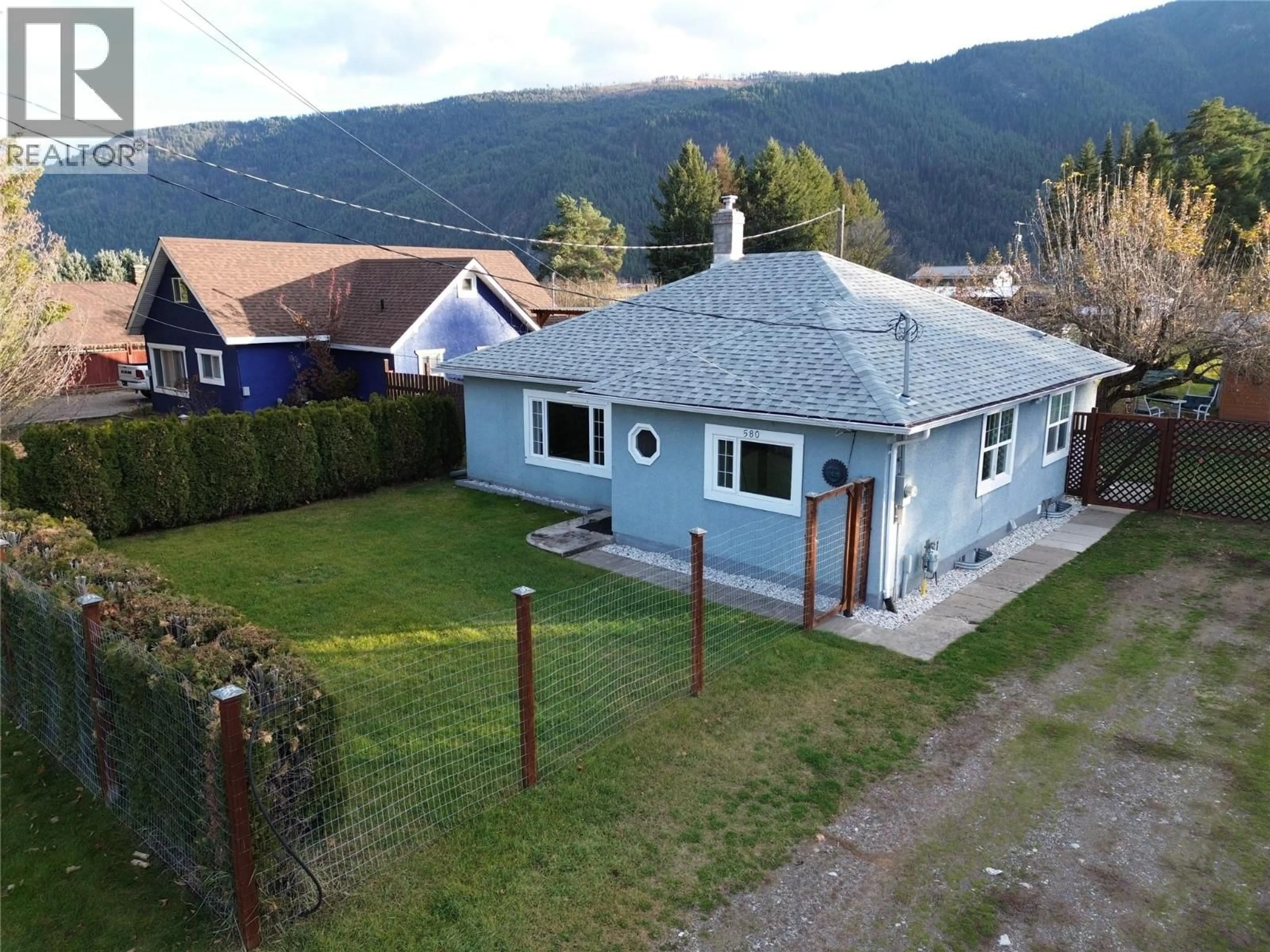 A pic from outside/outdoor area/front of a property/back of a property/a pic from drone, mountain view for 580 CAMERON AVENUE, Grand Forks British Columbia V0H1H4