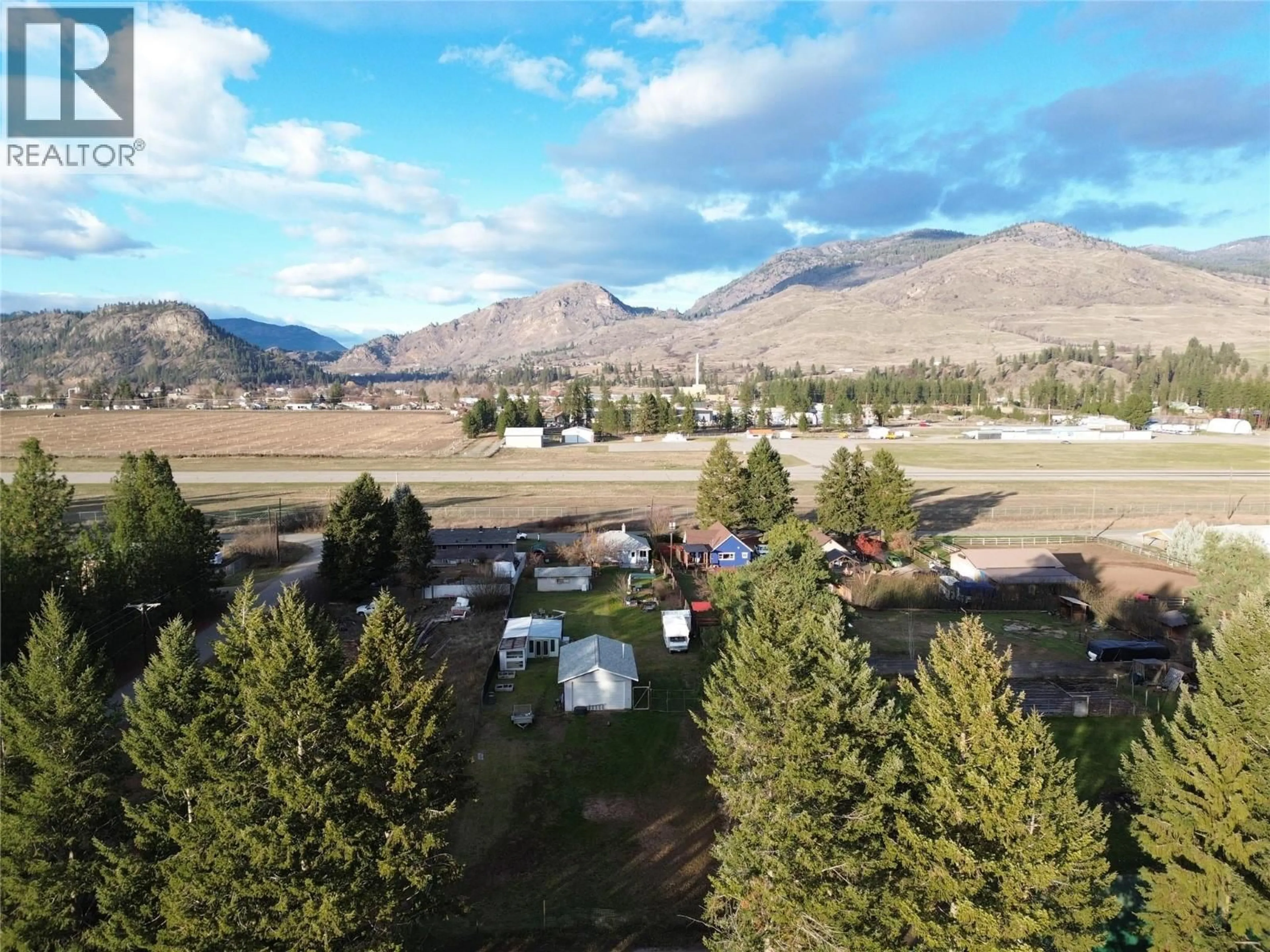 A pic from outside/outdoor area/front of a property/back of a property/a pic from drone, mountain view for 580 CAMERON AVENUE, Grand Forks British Columbia V0H1H4