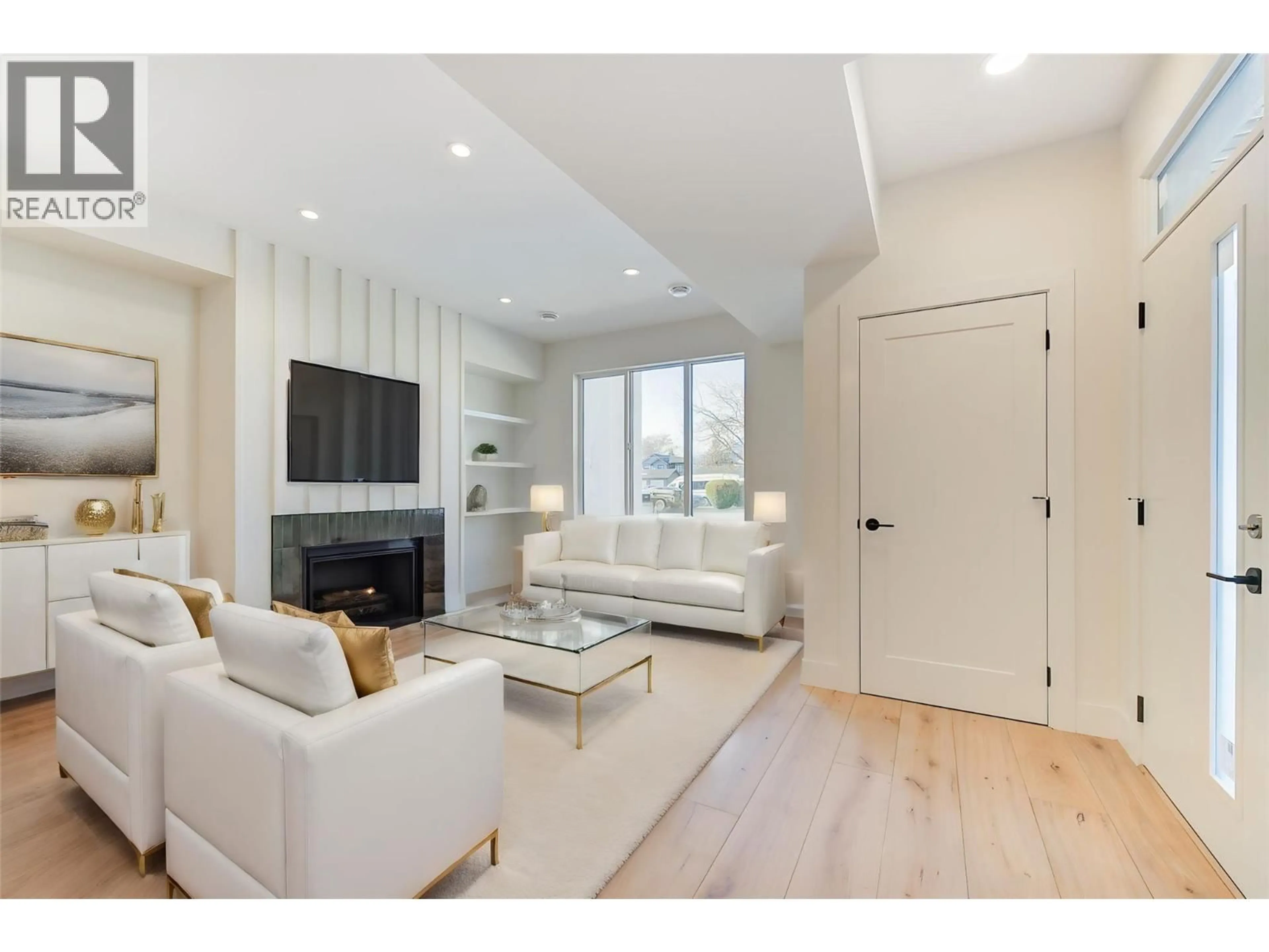 Living room with furniture, wood/laminate floor for 857 KINNEAR COURT, Kelowna British Columbia V1Y8A9