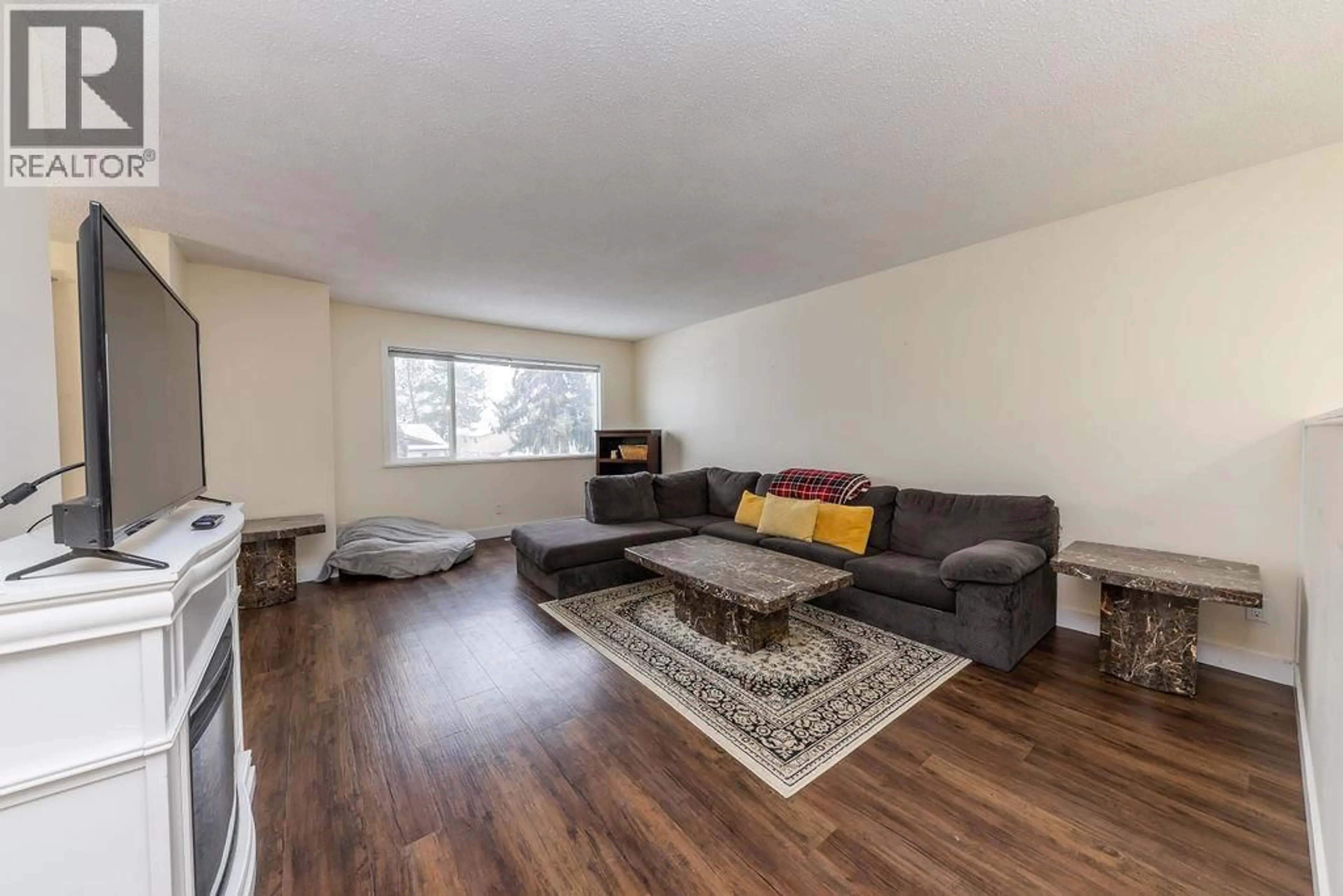 Living room with furniture, wood/laminate floor for 353 WADDINGTON DRIVE, Kamloops British Columbia V2E1S3