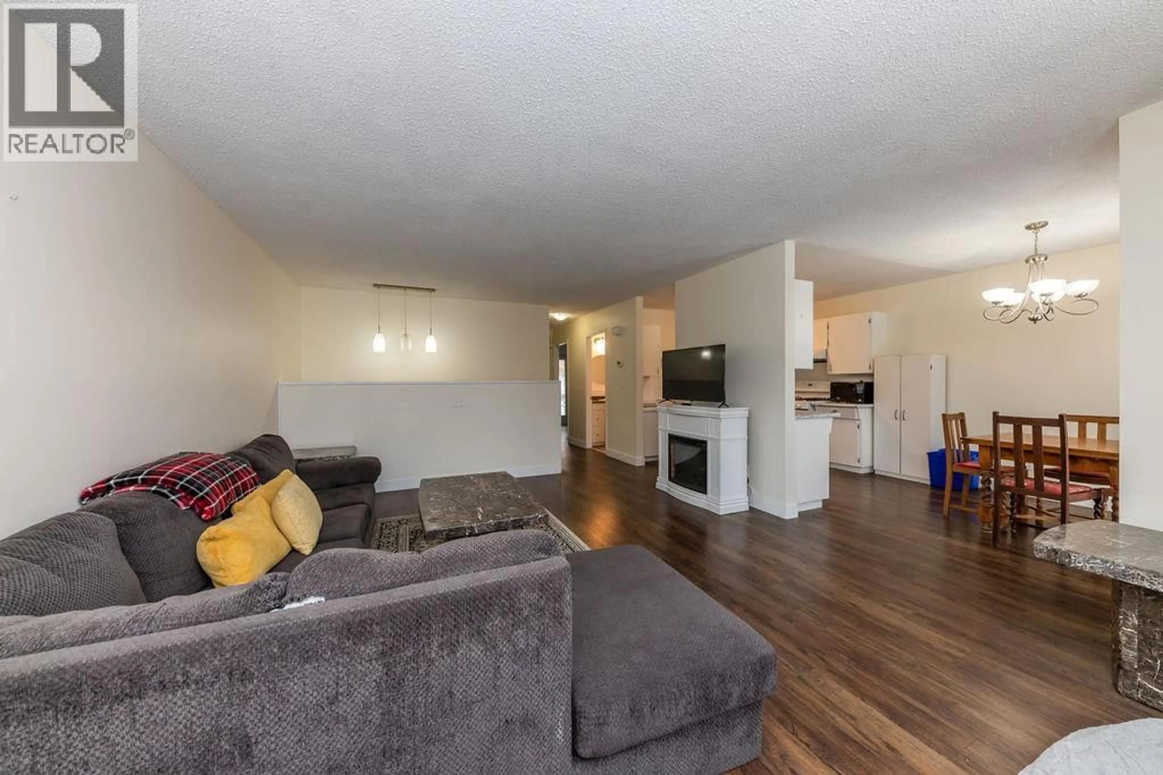 Living room with furniture, wood/laminate floor for 353 WADDINGTON DRIVE, Kamloops British Columbia V2E1S3