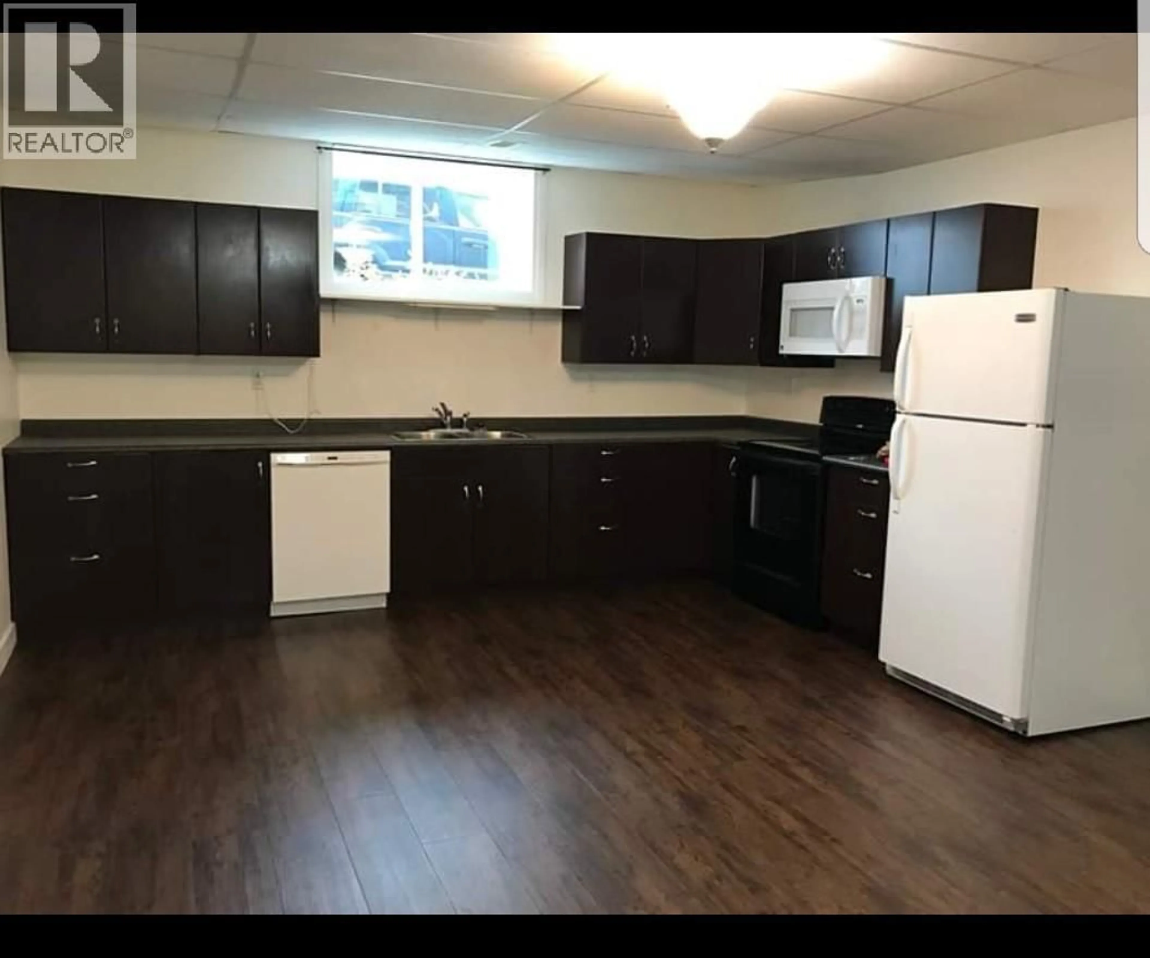 Standard kitchen, wood/laminate floor for 10203 16 STREET, Dawson Creek British Columbia V1G3Z9