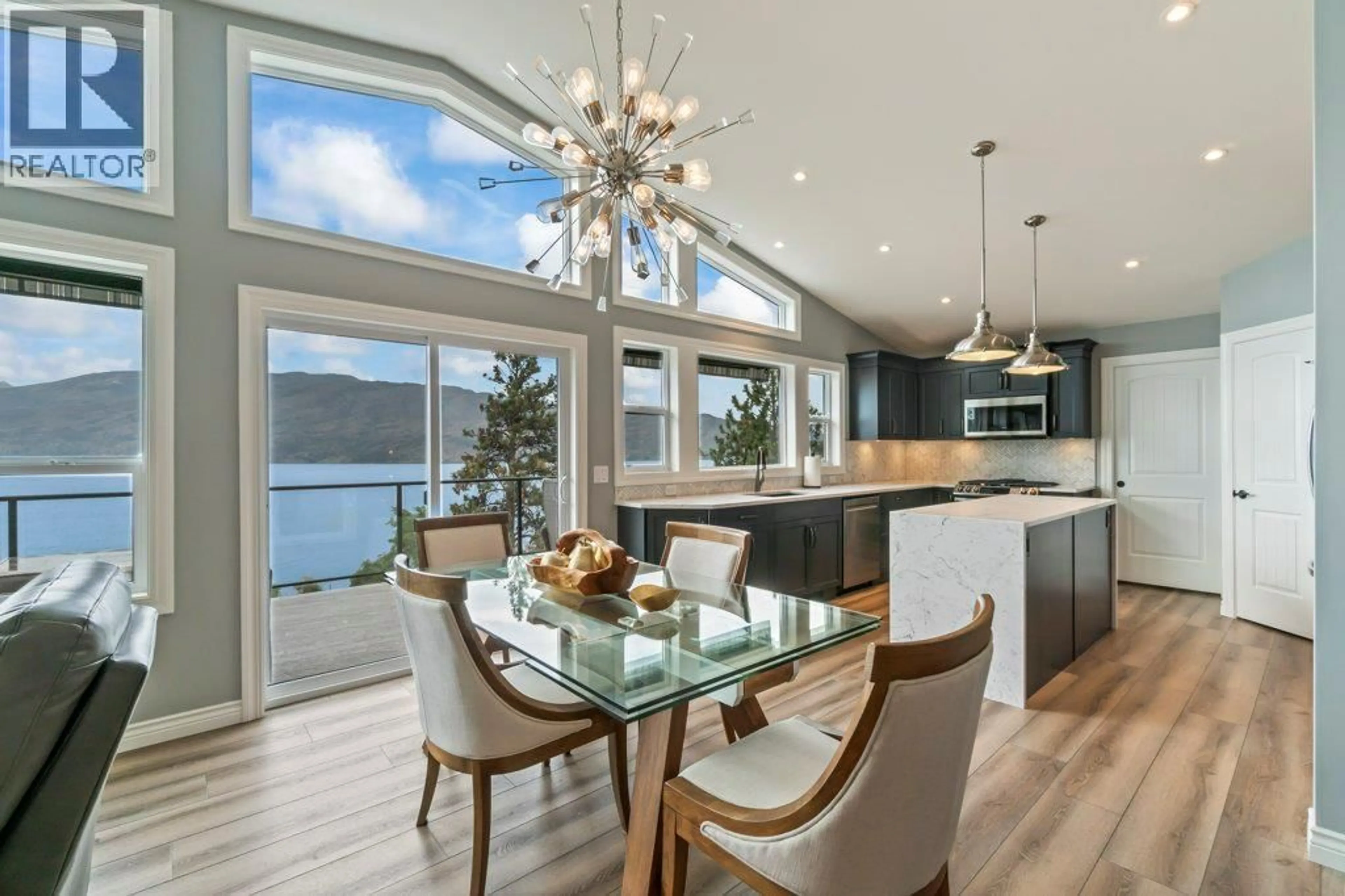 Open concept kitchen, wood/laminate floor for 3949 DESERT PINES AVENUE, Peachland British Columbia V0H1X2