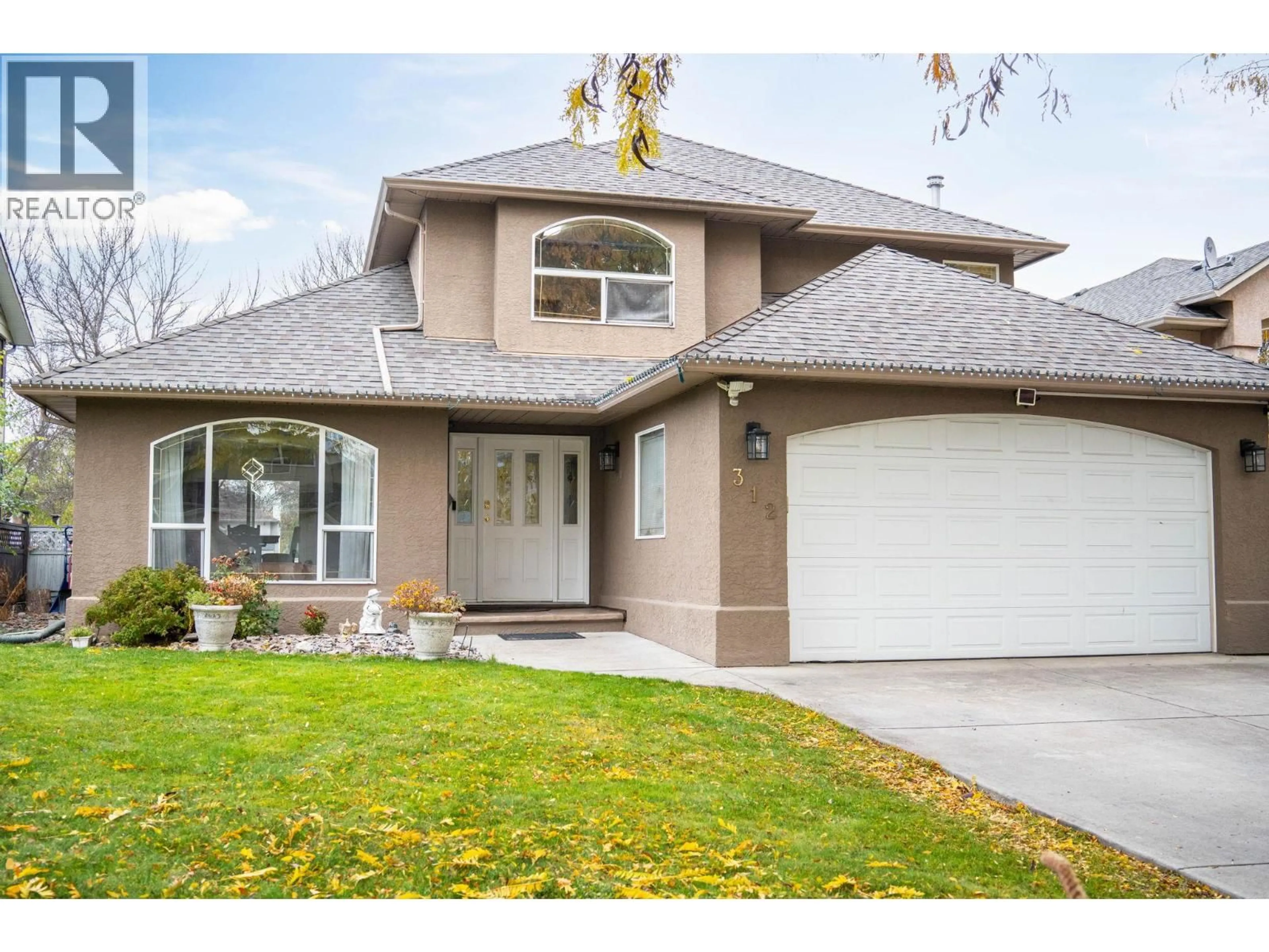 Home with vinyl exterior material, street for 312 FIZET AVENUE, Kelowna British Columbia V1X7P5