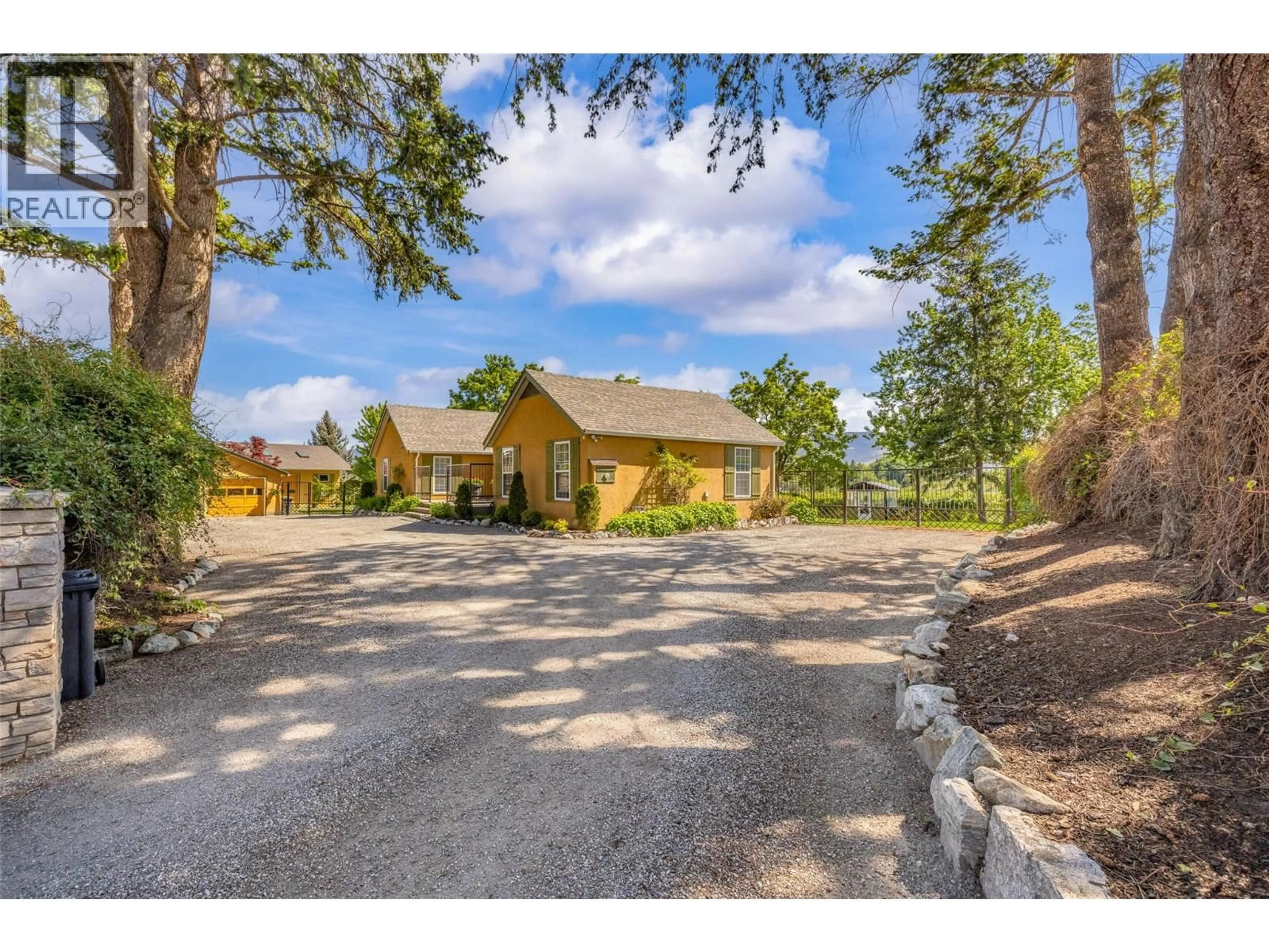 A pic from outside/outdoor area/front of a property/back of a property/a pic from drone, street for 2430 LONGHILL ROAD, Kelowna British Columbia V1V2G3