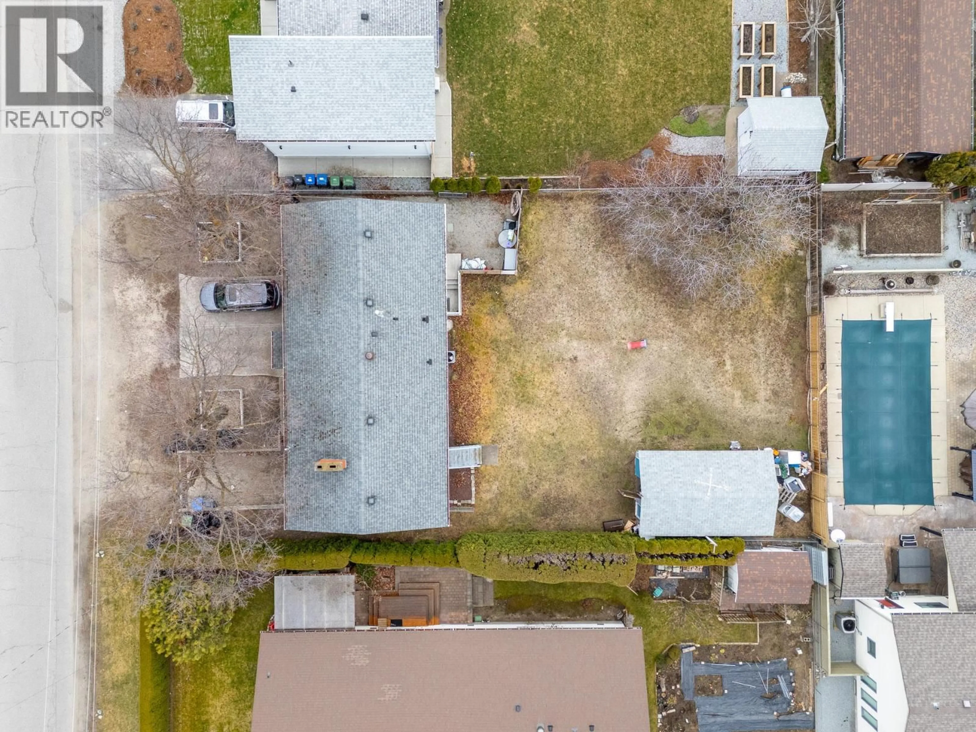A pic from outside/outdoor area/front of a property/back of a property/a pic from drone, street for 714 YOUNG ROAD, Kelowna British Columbia V1W1A8