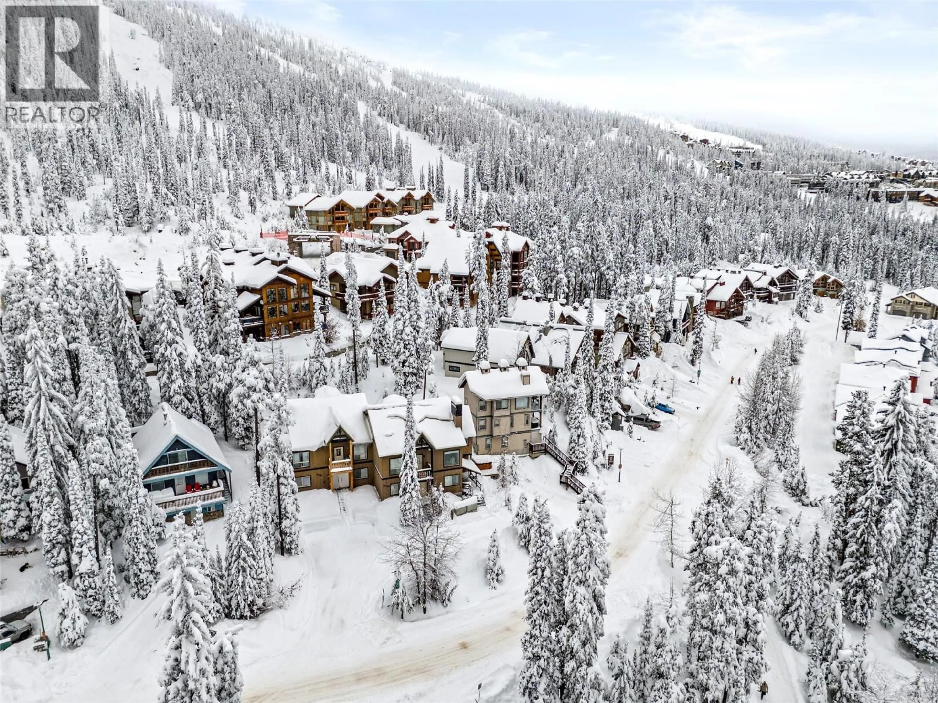 A pic from outside/outdoor area/front of a property/back of a property/a pic from drone, mountain view for A - 5882 SNOW PINES CRESCENT, Kelowna British Columbia V1P1T4