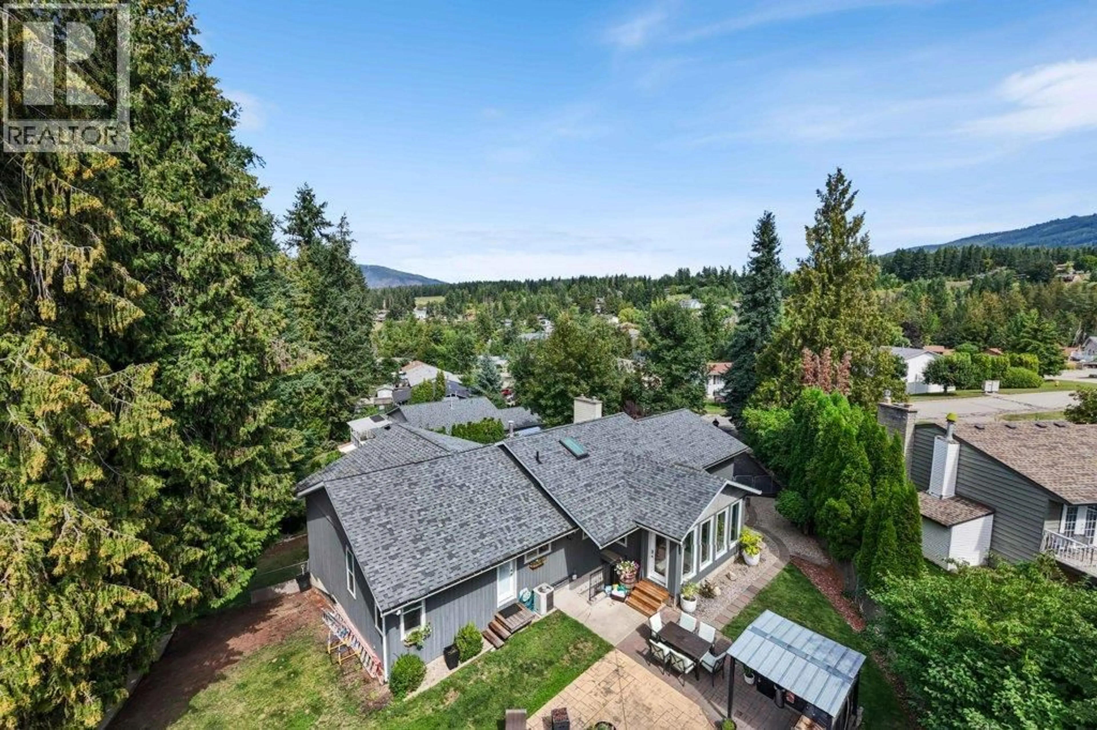 A pic from outside/outdoor area/front of a property/back of a property/a pic from drone, mountain view for 2131 21 STREET NORTHEAST, Salmon Arm British Columbia V1E3E4
