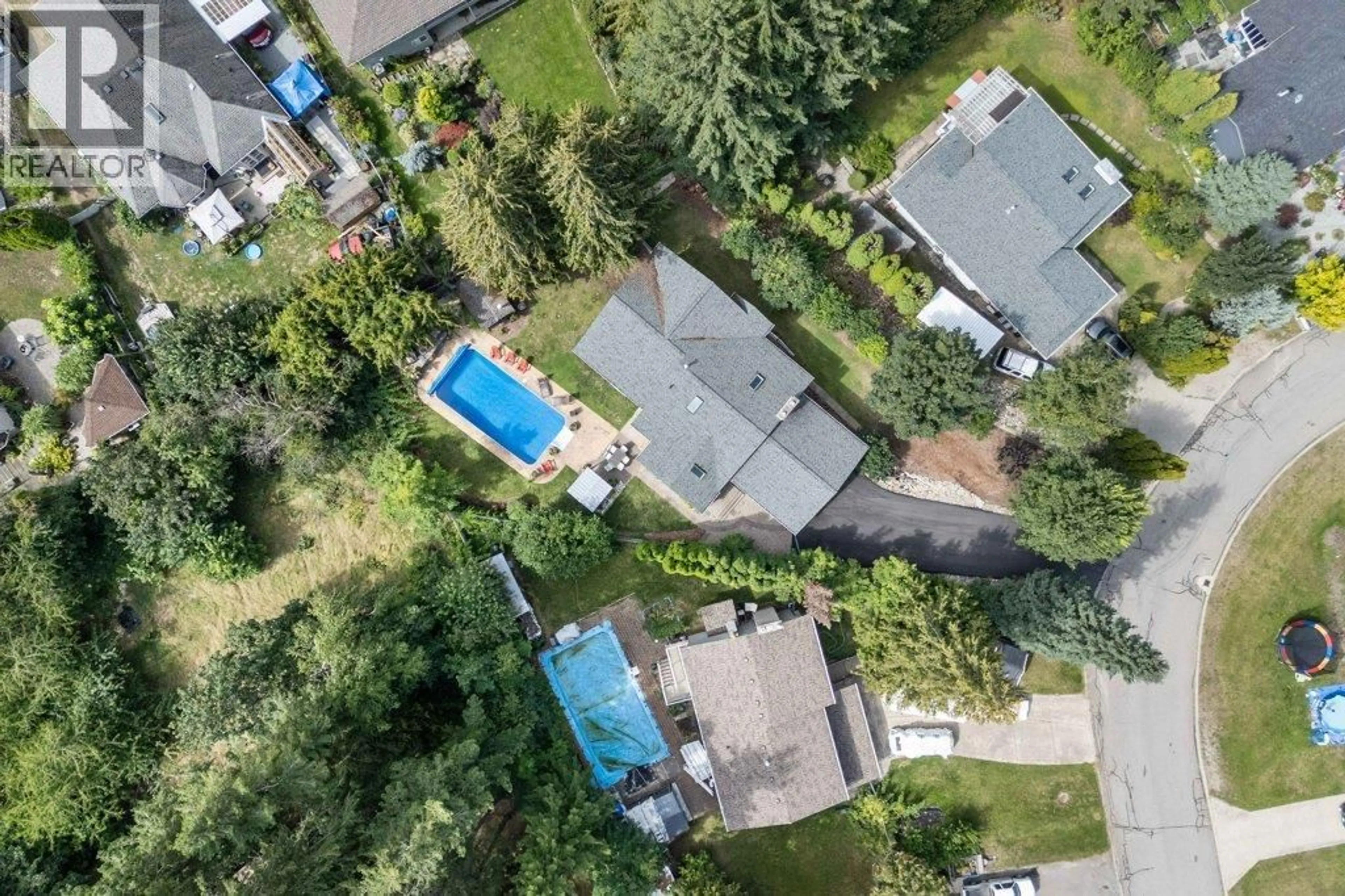 A pic from outside/outdoor area/front of a property/back of a property/a pic from drone, street for 2131 21 STREET NORTHEAST, Salmon Arm British Columbia V1E3E4