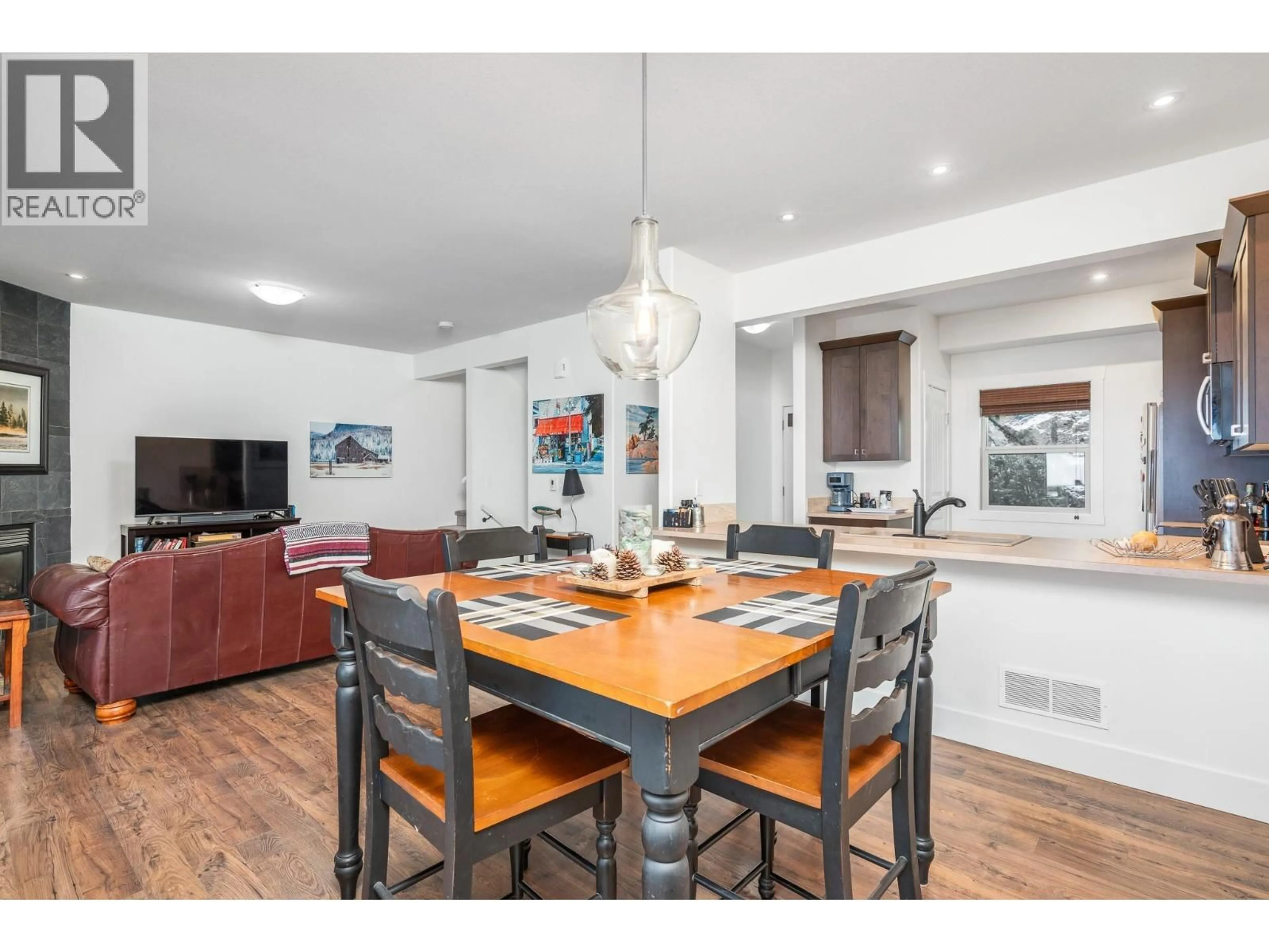 Open concept kitchen, wood/laminate floor for 21 - 1040 MT REVELSTOKE PLACE, Vernon British Columbia V1B4E3