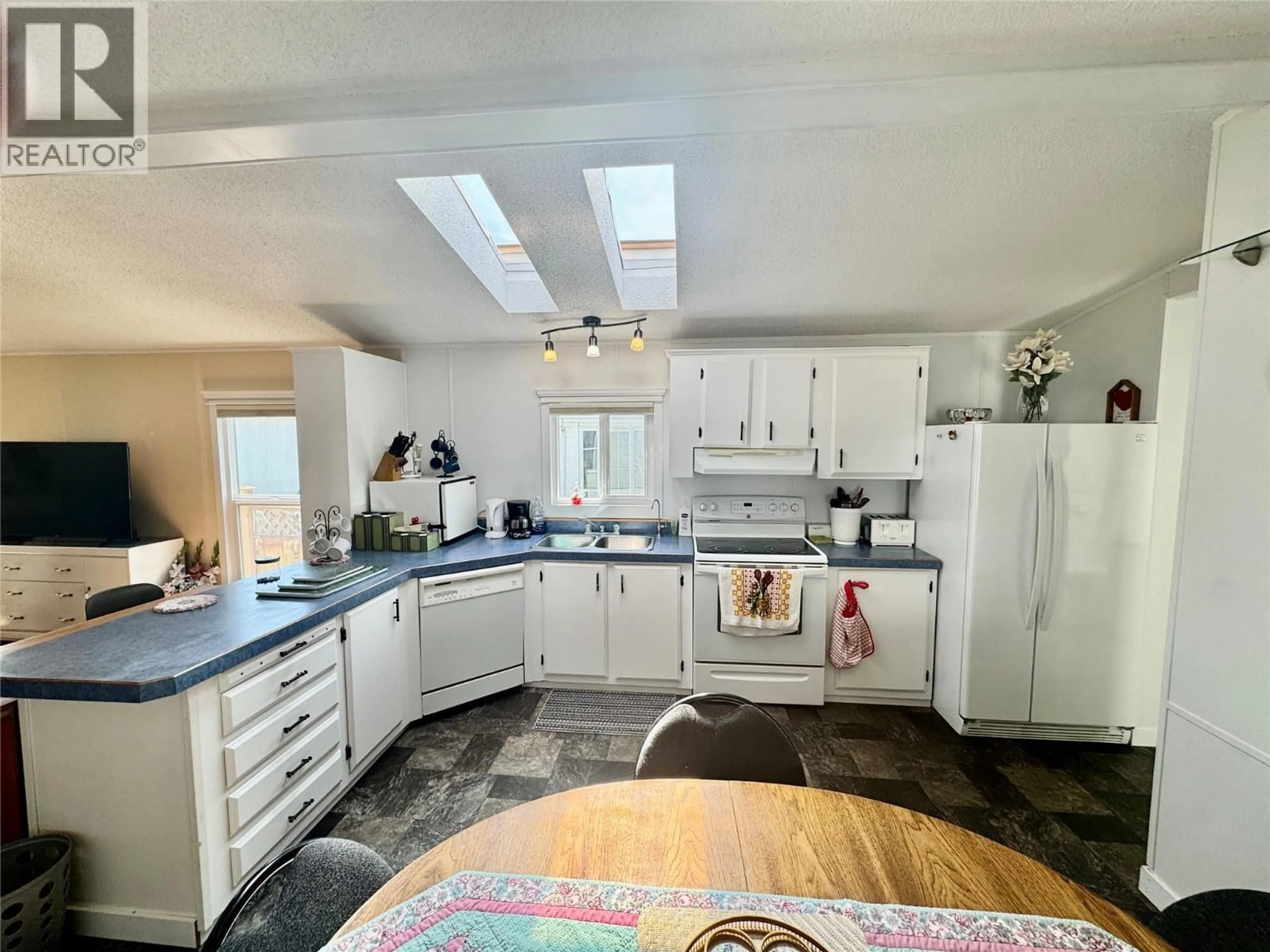 Open concept kitchen, ceramic/tile floor for 135 - 720 COMMONWEALTH ROAD, Kelowna British Columbia V4V1R8