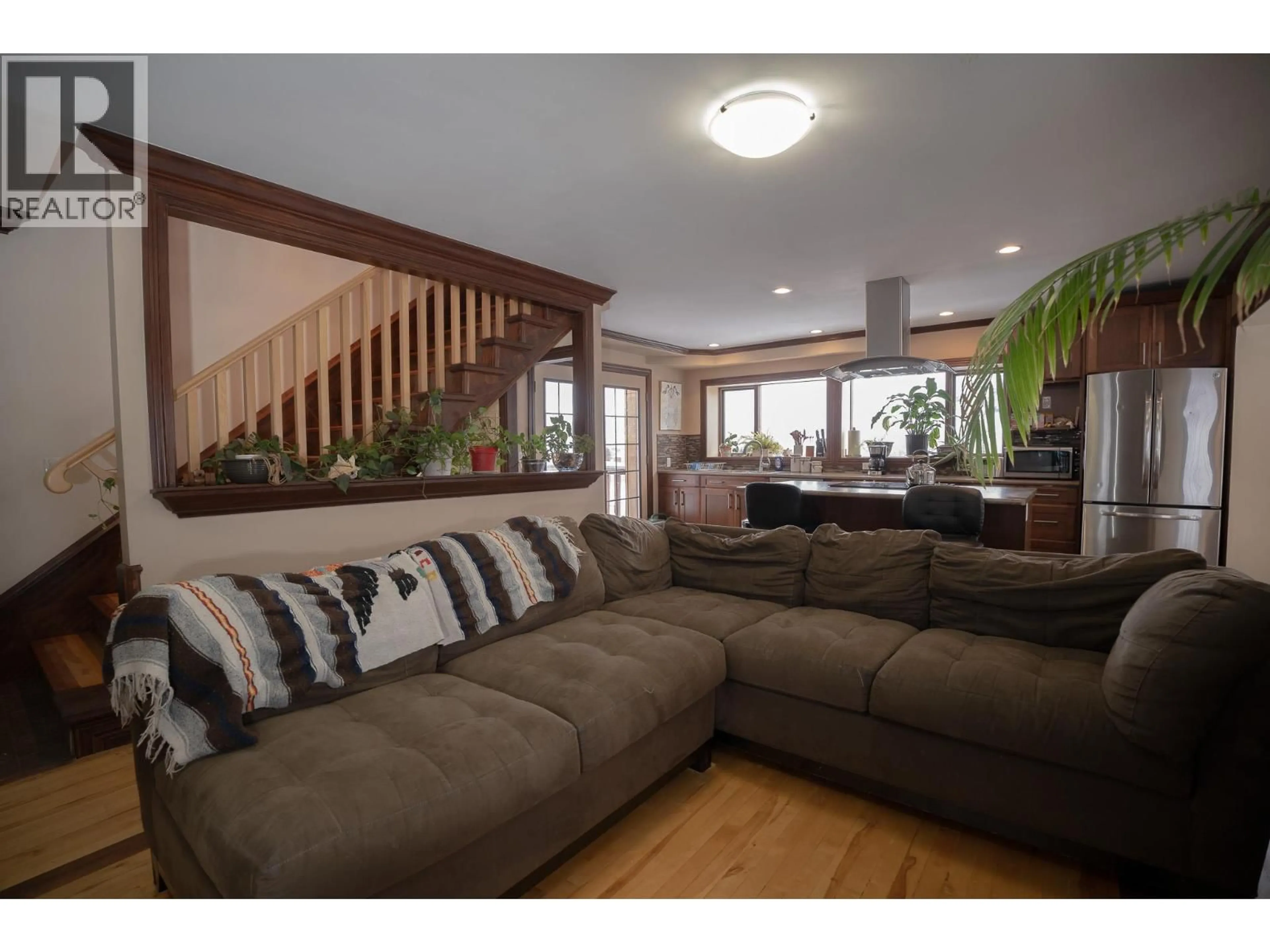 Living room with furniture, wood/laminate floor for 299 SEYMOUR STREET WEST, Kamloops British Columbia V2C1E8
