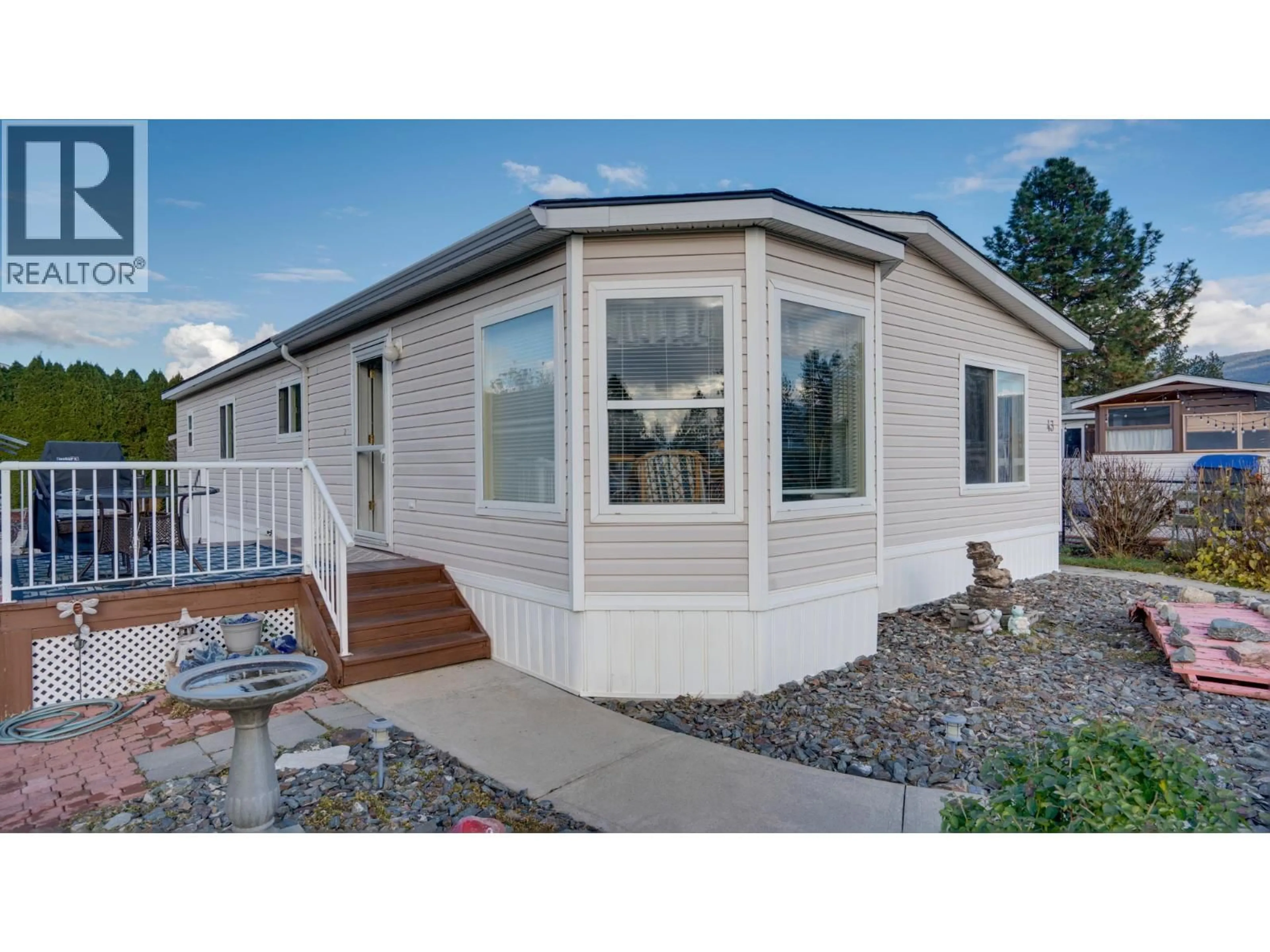 Home with vinyl exterior material, street for 43 - 9510 HIGHWAY 97N OTHER, Vernon British Columbia V1H1R8