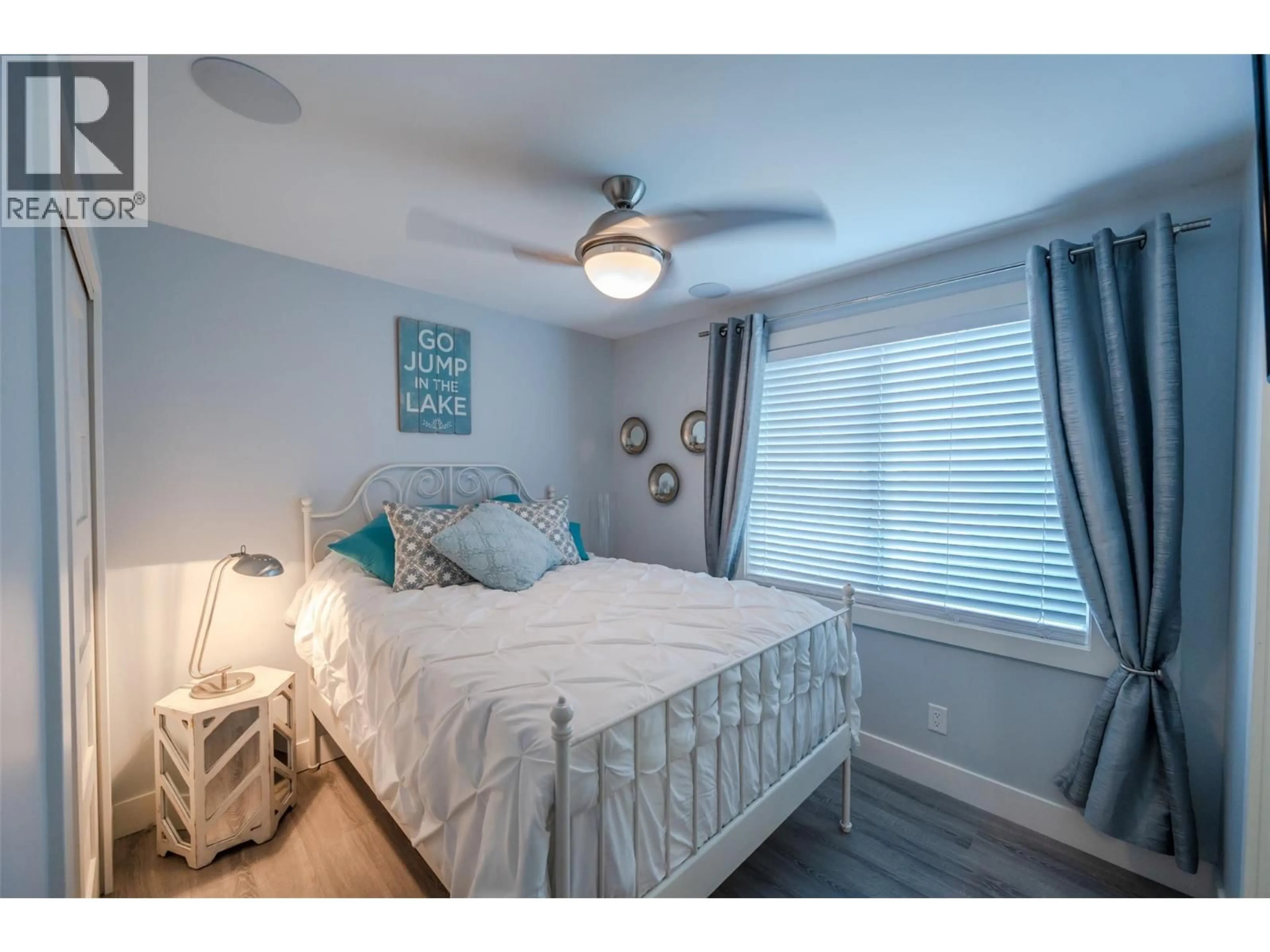 Bedroom with bed, wood/laminate floor for 1362 GREEN BAY ROAD, West Kelowna British Columbia V4T2B6