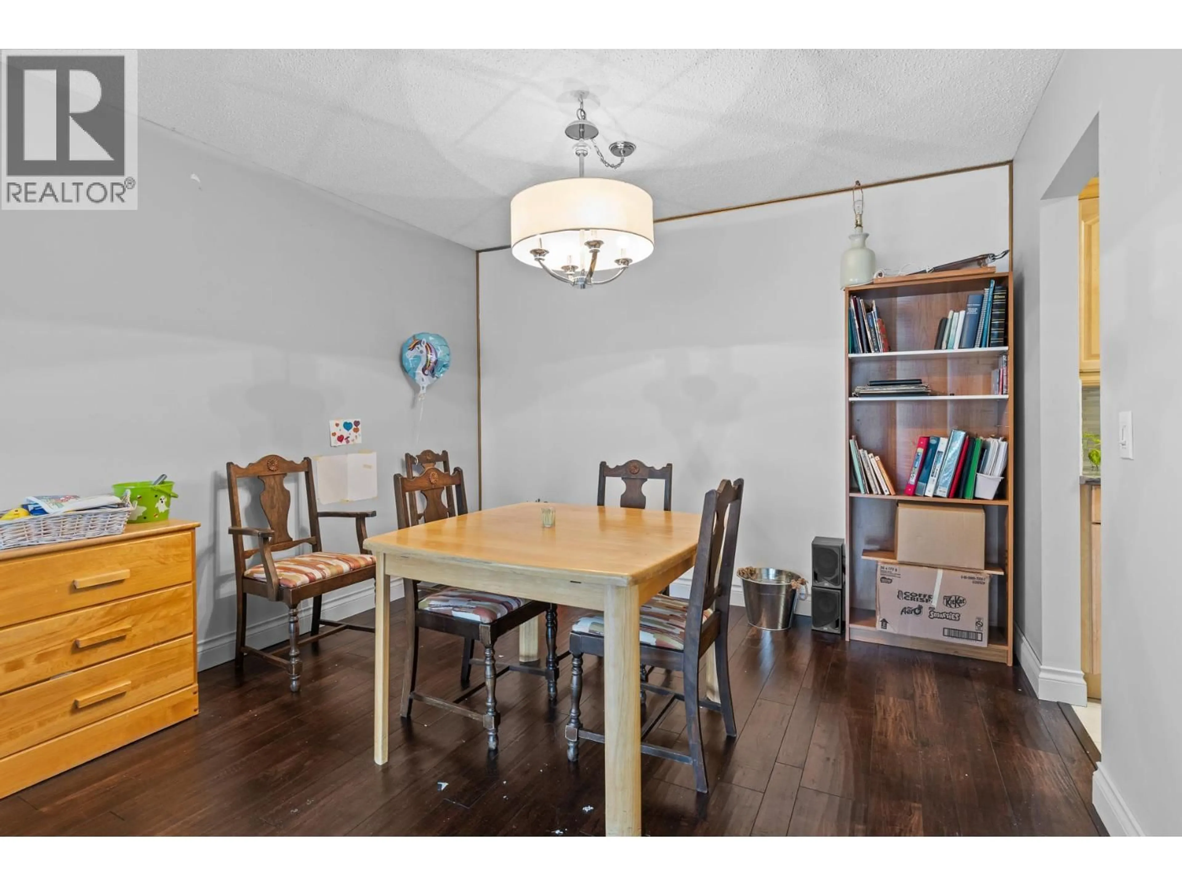 Dining room, wood/laminate floor for 204 - 1860 RICHTER STREET, Kelowna British Columbia V1Y2M9