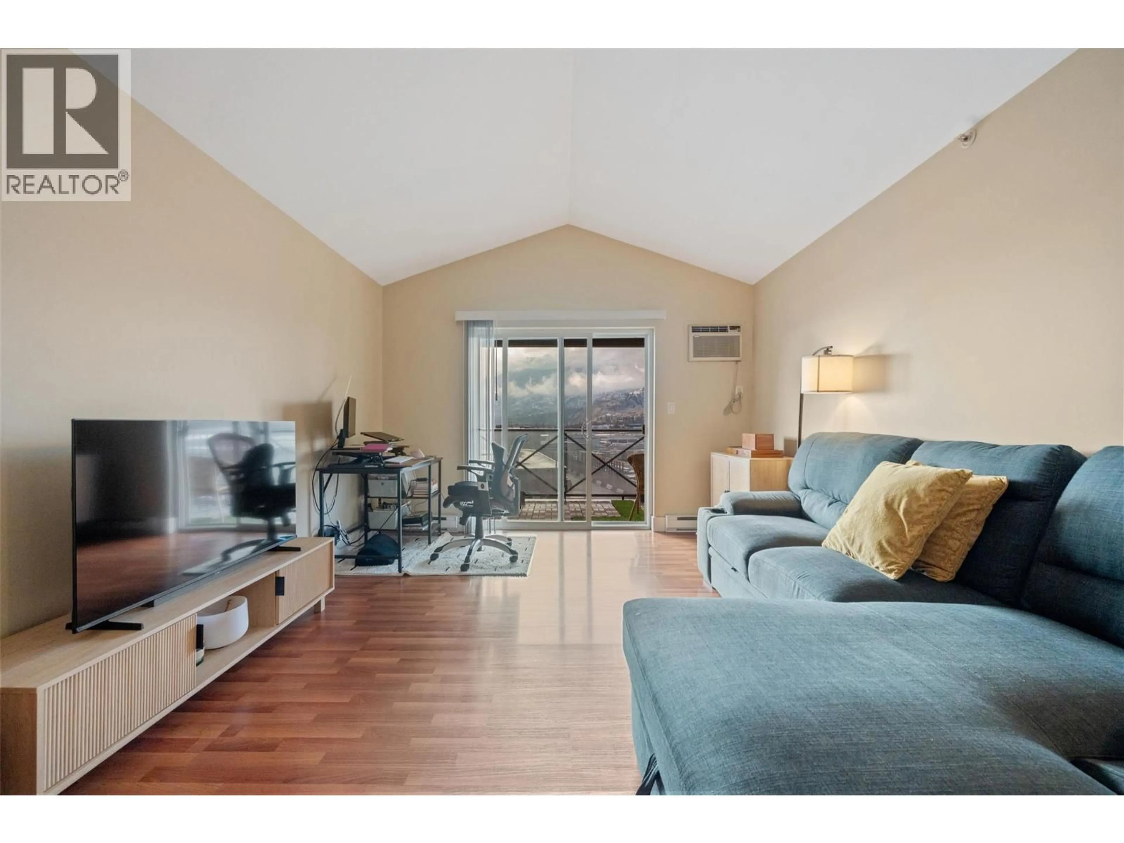 Living room with furniture, unknown for 406 - 256 HASTINGS AVENUE, Penticton British Columbia V2A2V6