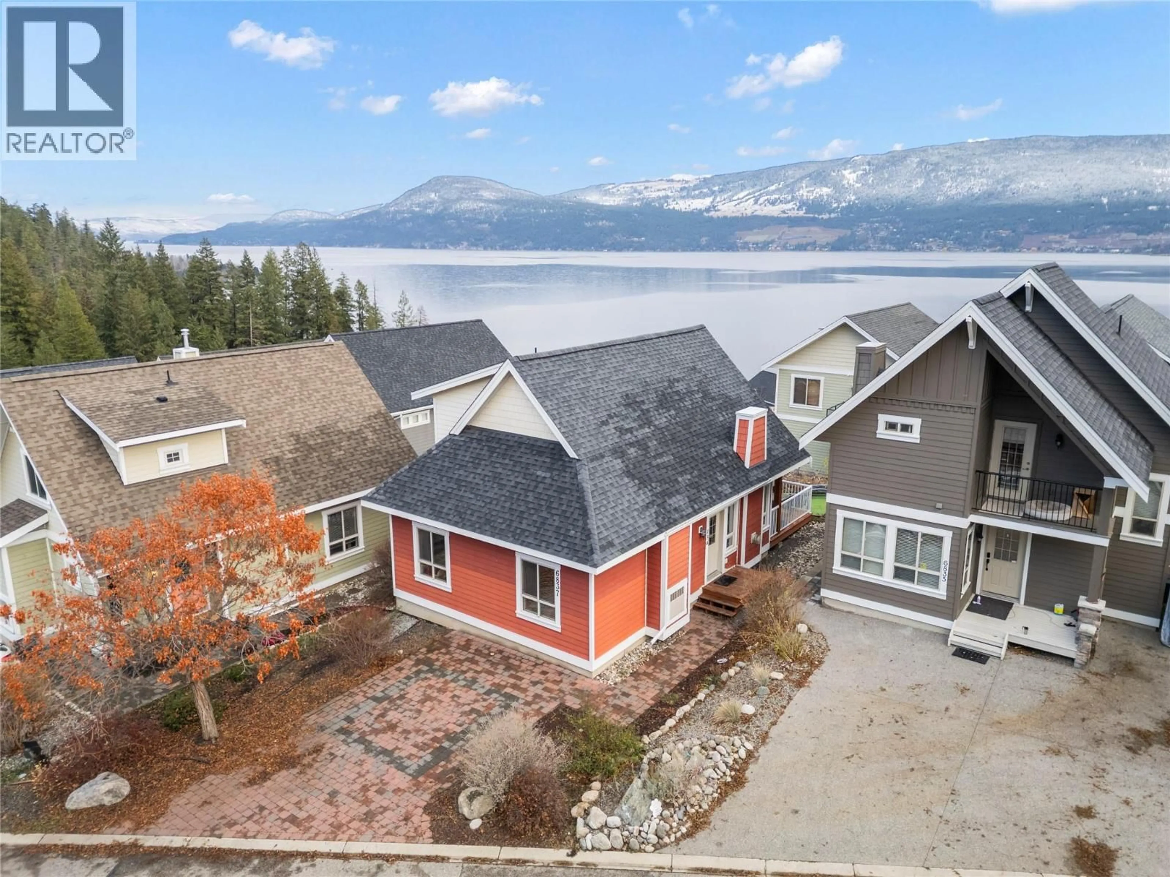 A pic from outside/outdoor area/front of a property/back of a property/a pic from drone, water/lake/river/ocean view for 134 - 6837 SANTIAGO LOOP, Kelowna British Columbia V1Z3R8
