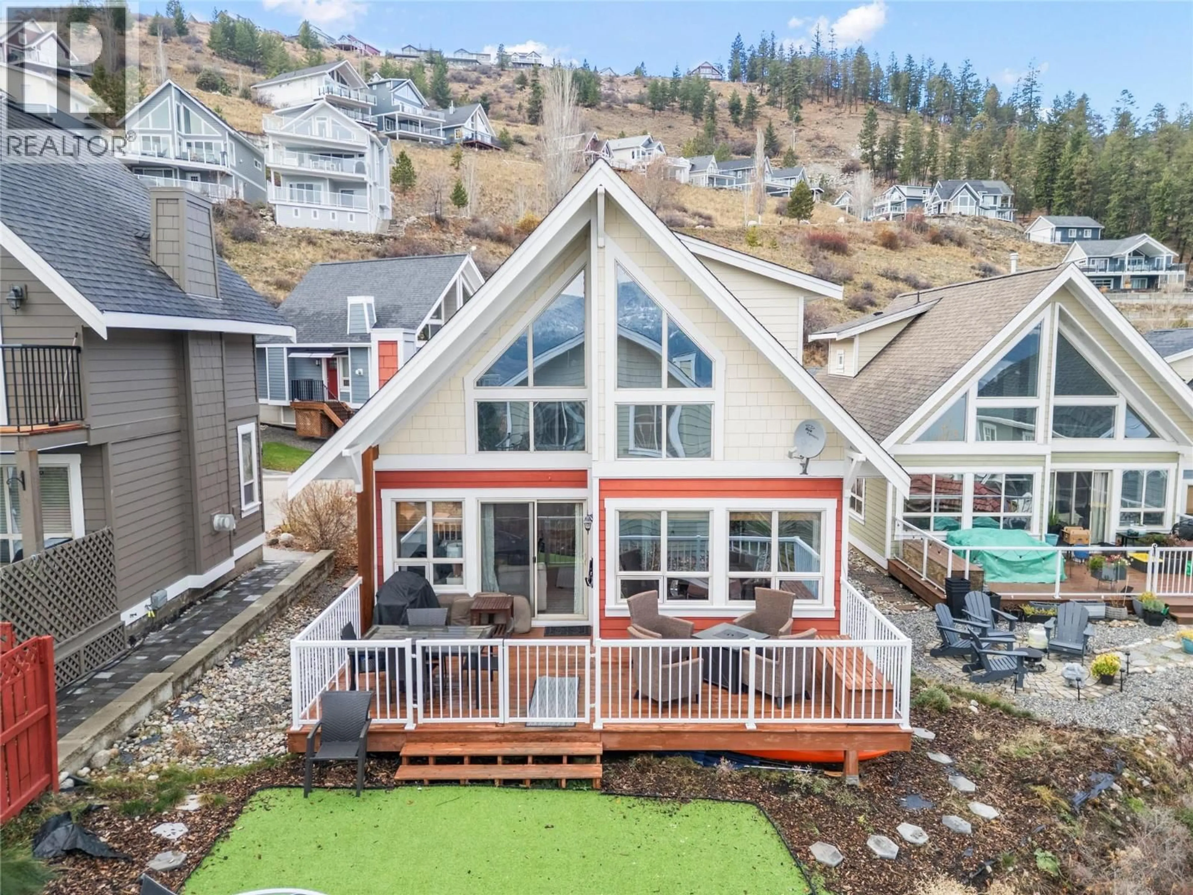 A pic from outside/outdoor area/front of a property/back of a property/a pic from drone, mountain view for 134 - 6837 SANTIAGO LOOP, Kelowna British Columbia V1Z3R8