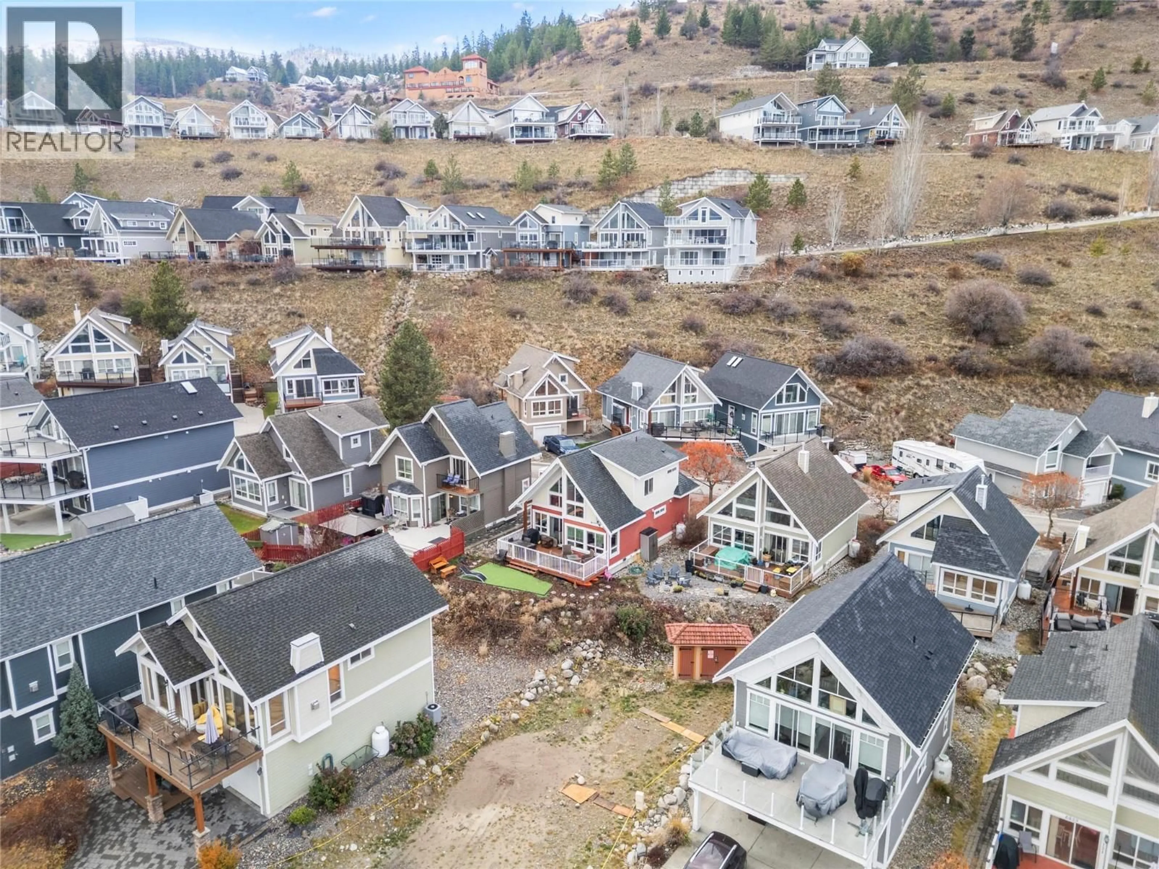 A pic from outside/outdoor area/front of a property/back of a property/a pic from drone, unknown for 134 - 6837 SANTIAGO LOOP, Kelowna British Columbia V1Z3R8