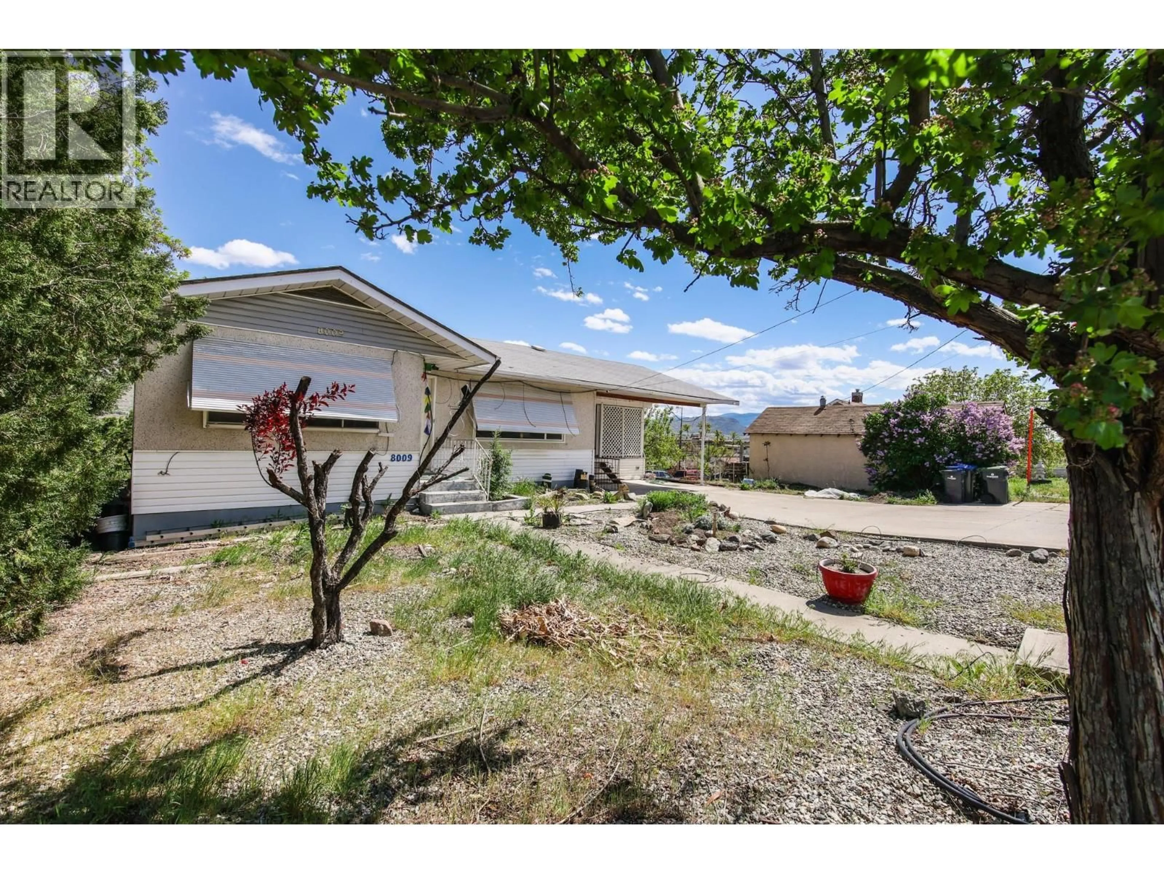 A pic from outside/outdoor area/front of a property/back of a property/a pic from drone, street for 8009 87TH STREET, Osoyoos British Columbia V0H1V0