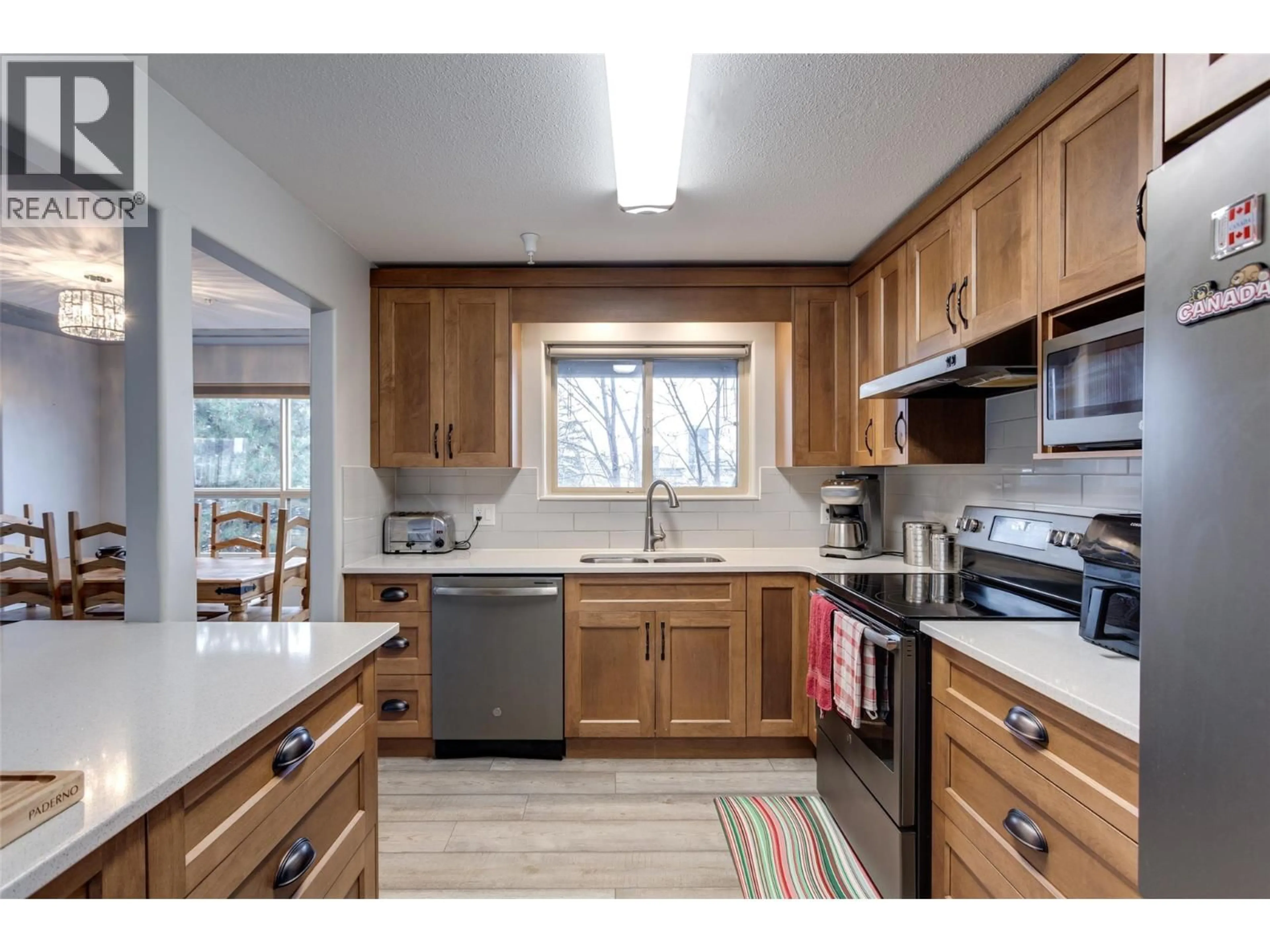 Standard kitchen, wood/laminate floor for 302 - 2130 VASILE ROAD, Kelowna British Columbia V1Y6H5