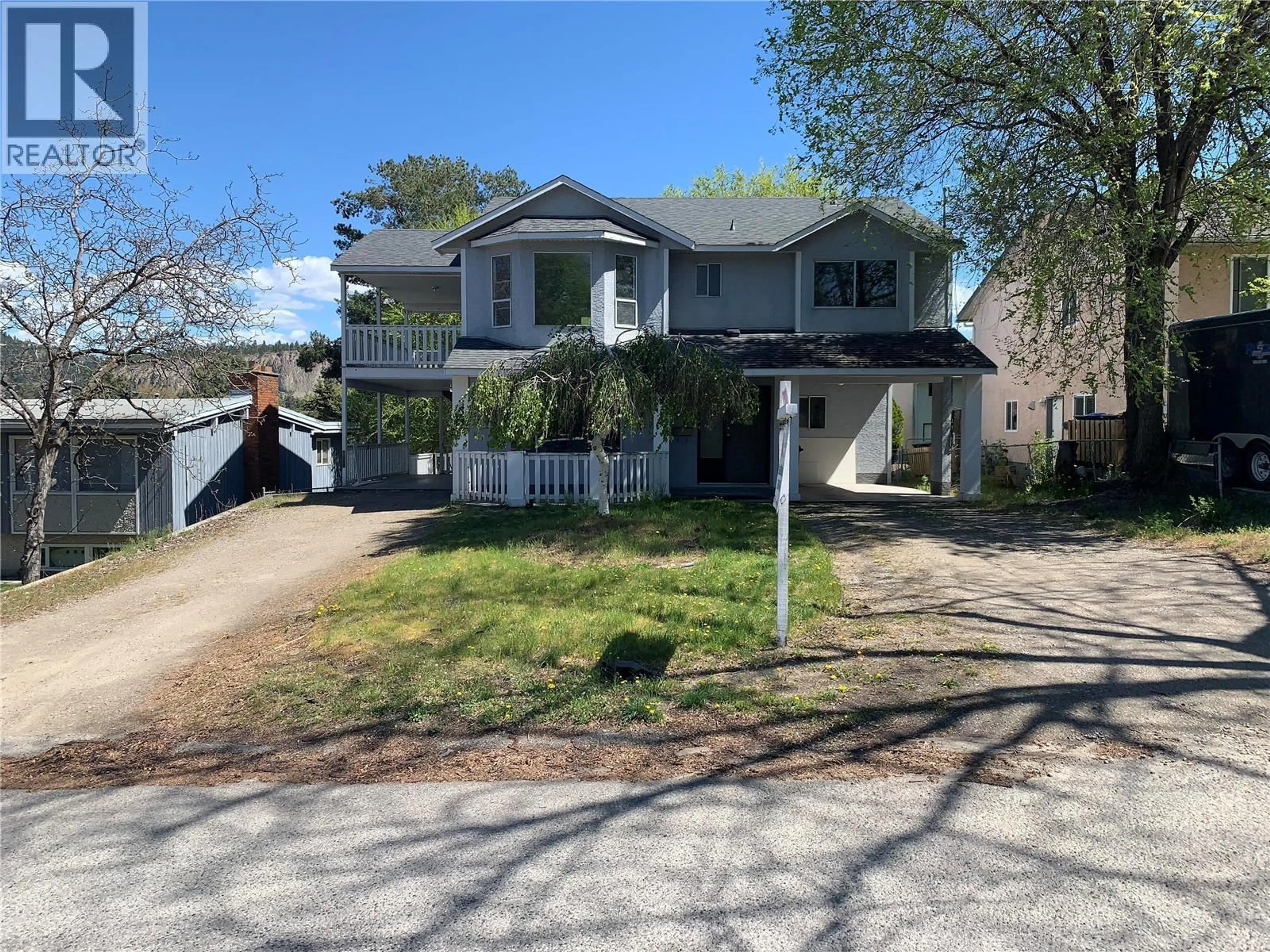 A pic from outside/outdoor area/front of a property/back of a property/a pic from drone, street for 1425 HIGHLAND DRIVE SOUTH, Kelowna British Columbia V1Y3W3