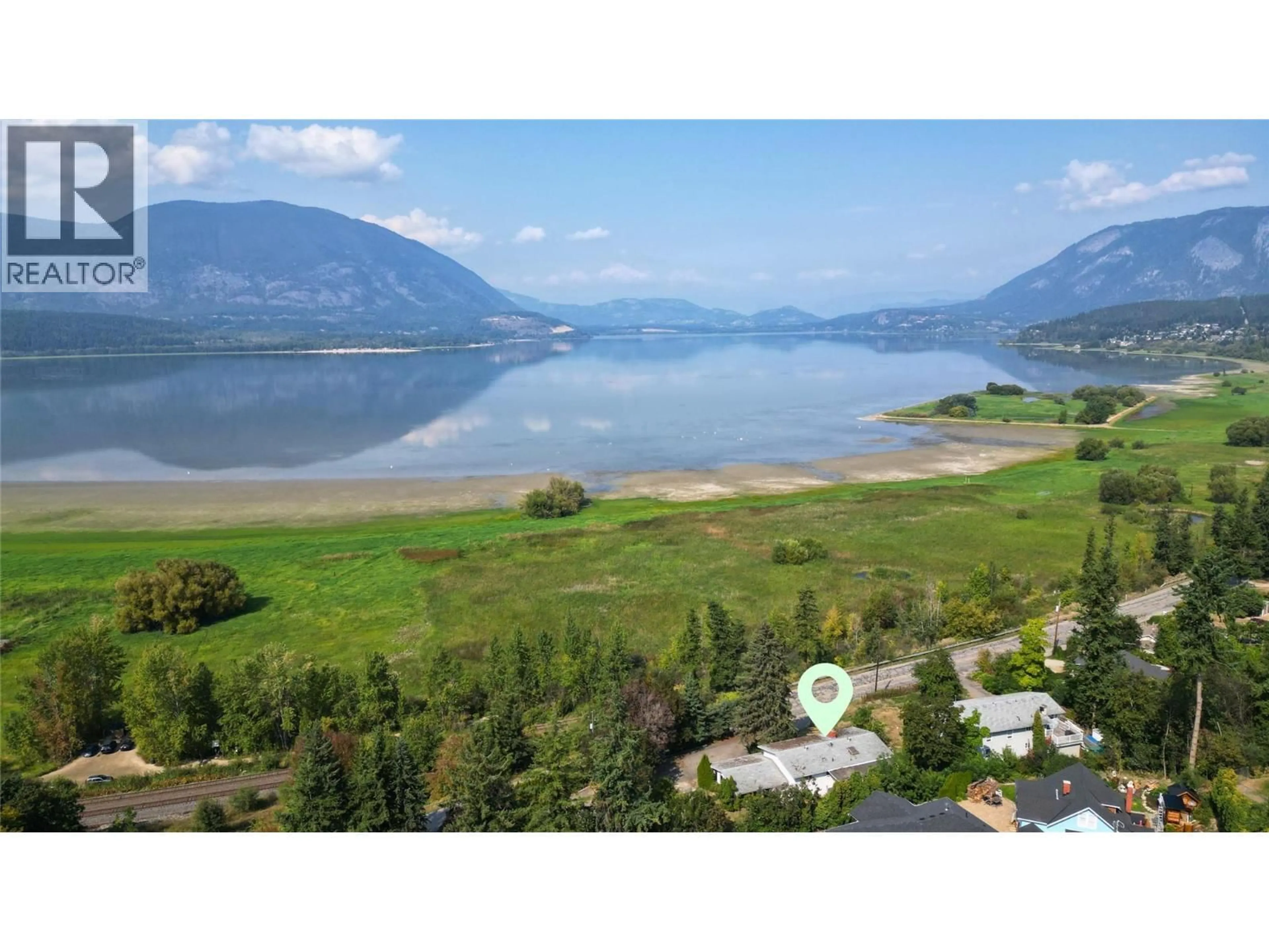 A pic from outside/outdoor area/front of a property/back of a property/a pic from drone, water/lake/river/ocean view for 1160 LAKESHORE ROAD NORTHEAST, Salmon Arm British Columbia V1E2V7