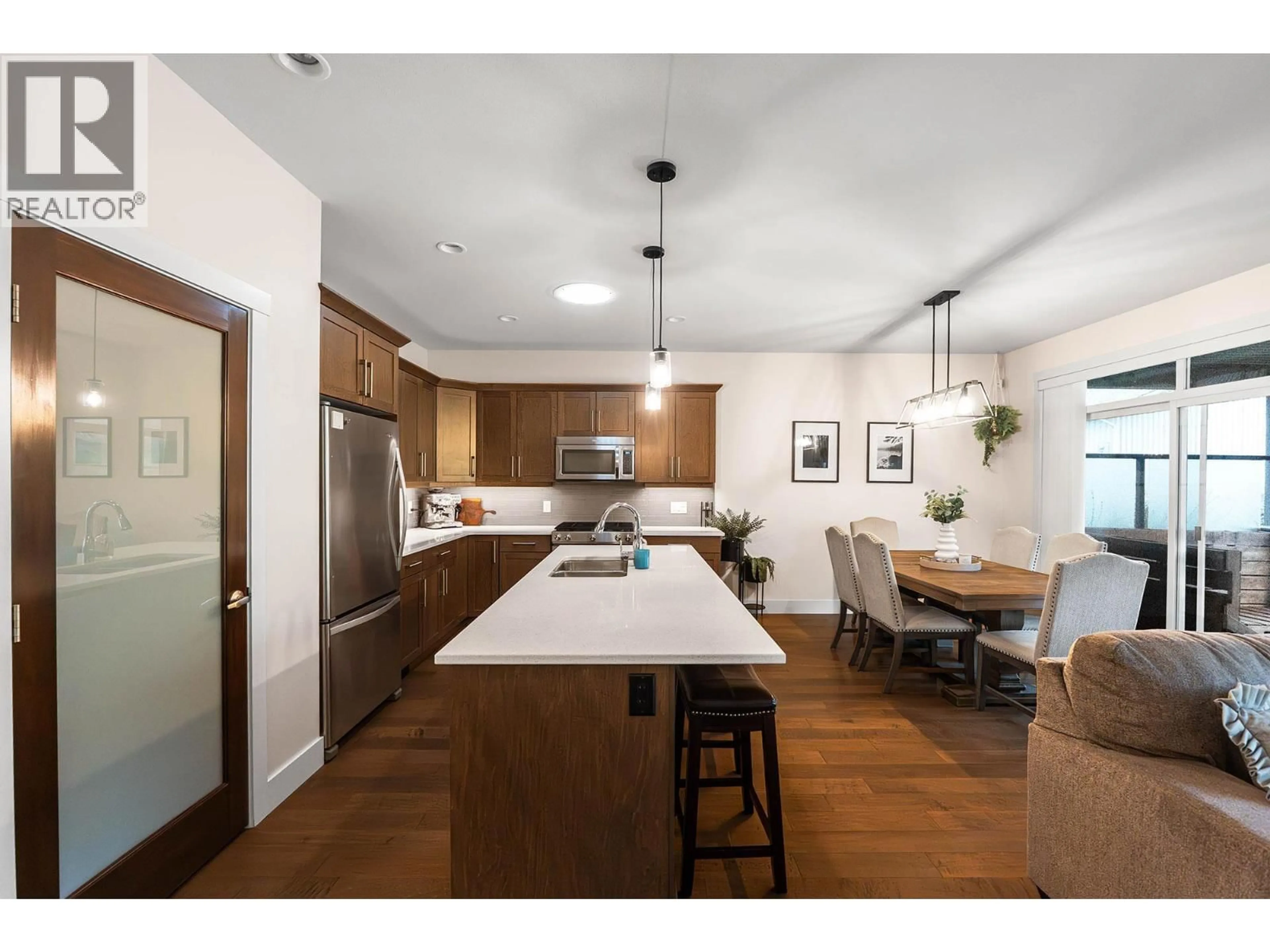 Open concept kitchen, wood/laminate floor for 1769 TOWER RANCH DRIVE, Kelowna British Columbia V1P1T2