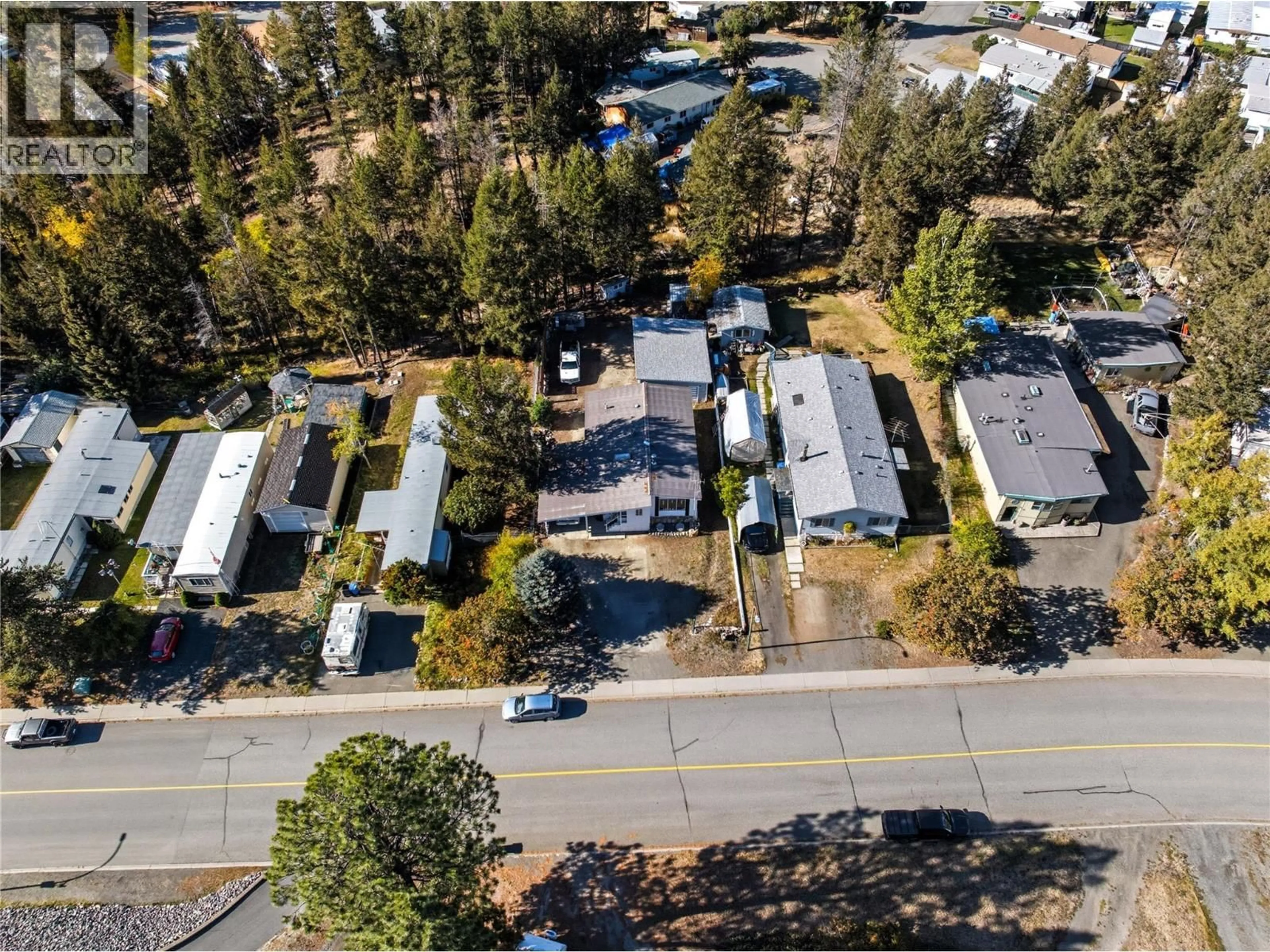 A pic from outside/outdoor area/front of a property/back of a property/a pic from drone, street for 24 JASPER DRIVE, Logan Lake British Columbia V0K1W0