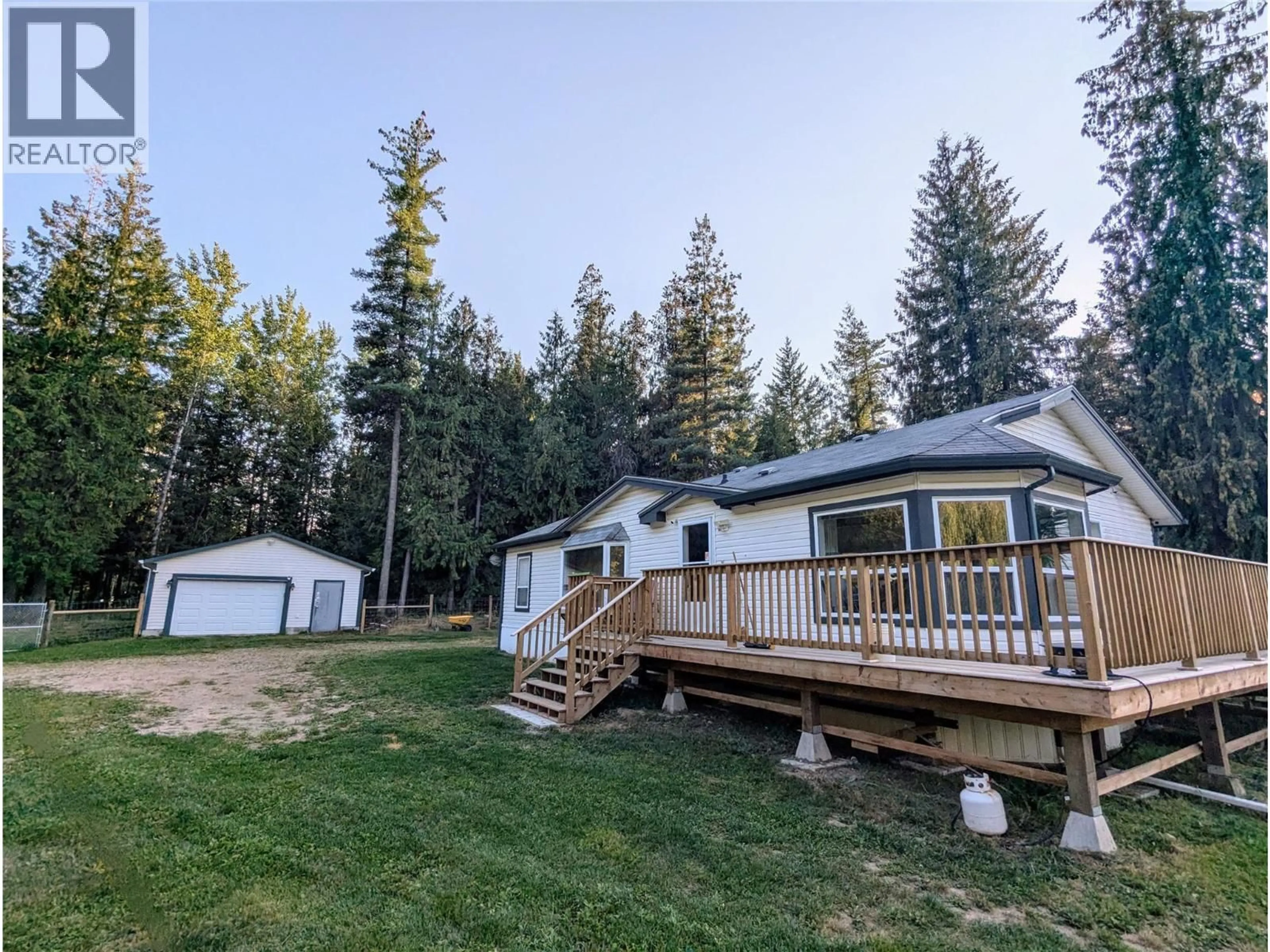 A pic from outside/outdoor area/front of a property/back of a property/a pic from drone, forest/trees view for 5060 TATLOW ROAD, Salmon Arm British Columbia V1E2P8