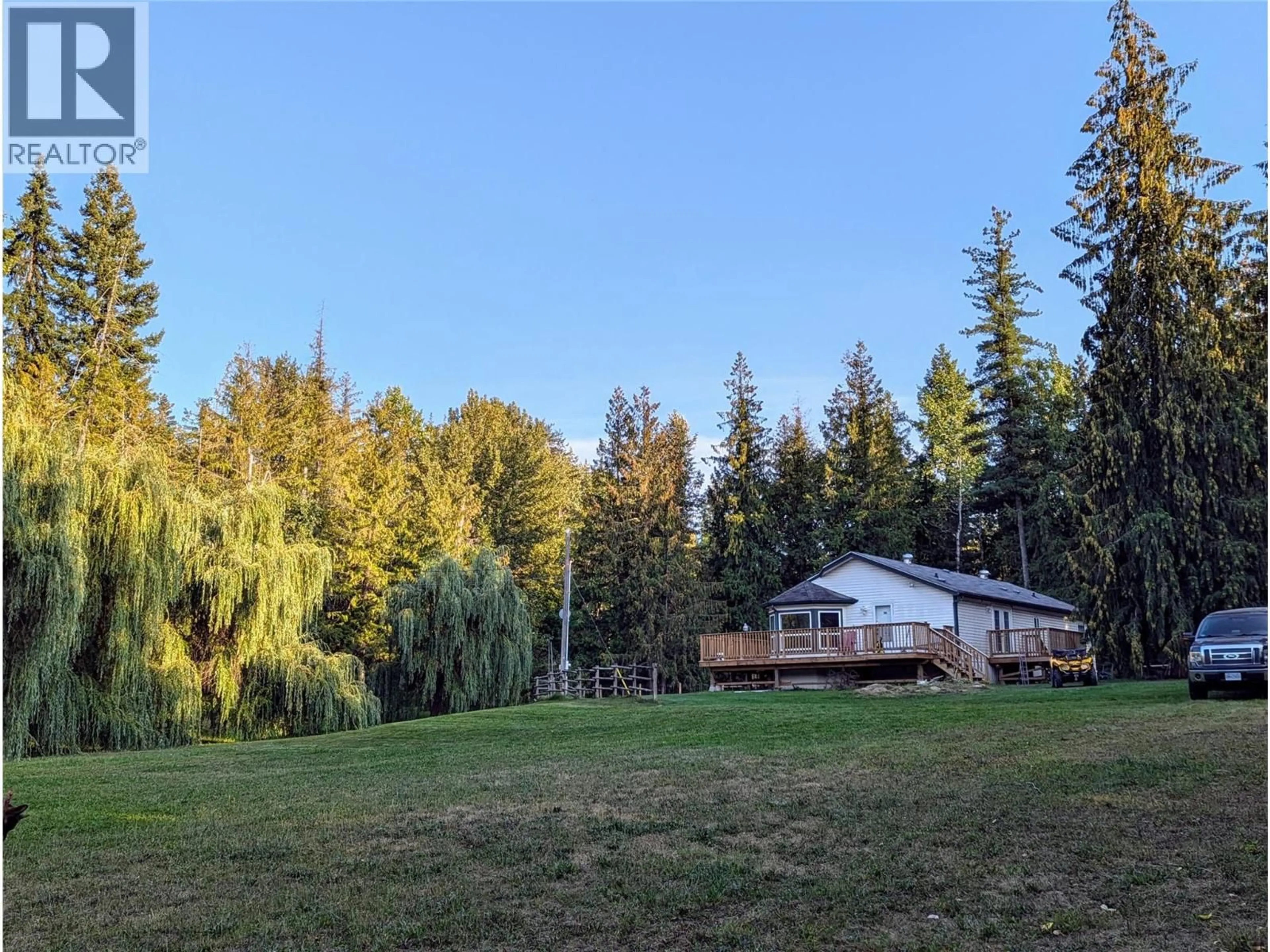 A pic from outside/outdoor area/front of a property/back of a property/a pic from drone, forest/trees view for 5060 TATLOW ROAD, Salmon Arm British Columbia V1E2P8