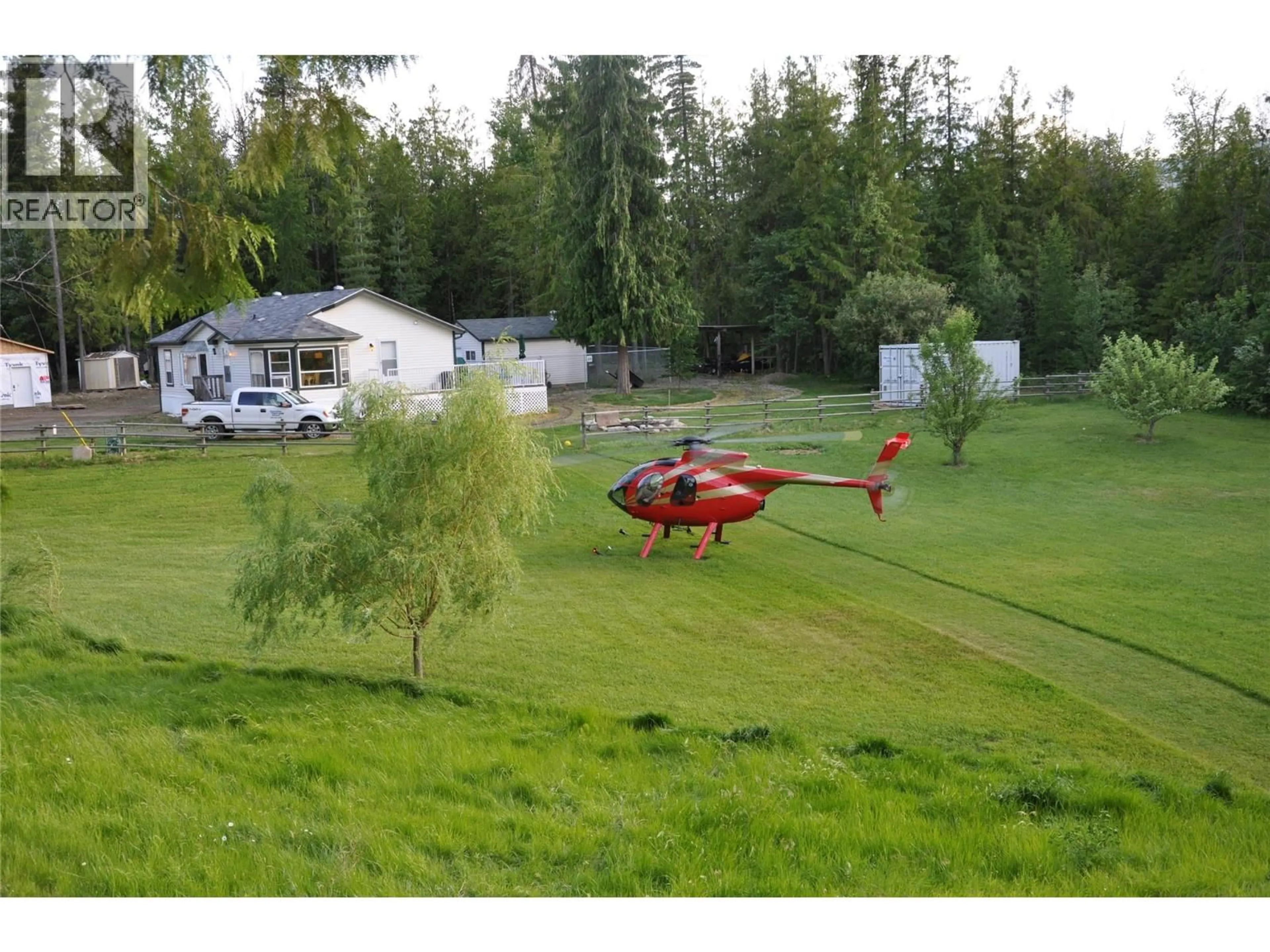 A pic from outside/outdoor area/front of a property/back of a property/a pic from drone, mountain view for 5060 TATLOW ROAD, Salmon Arm British Columbia V1E2P8