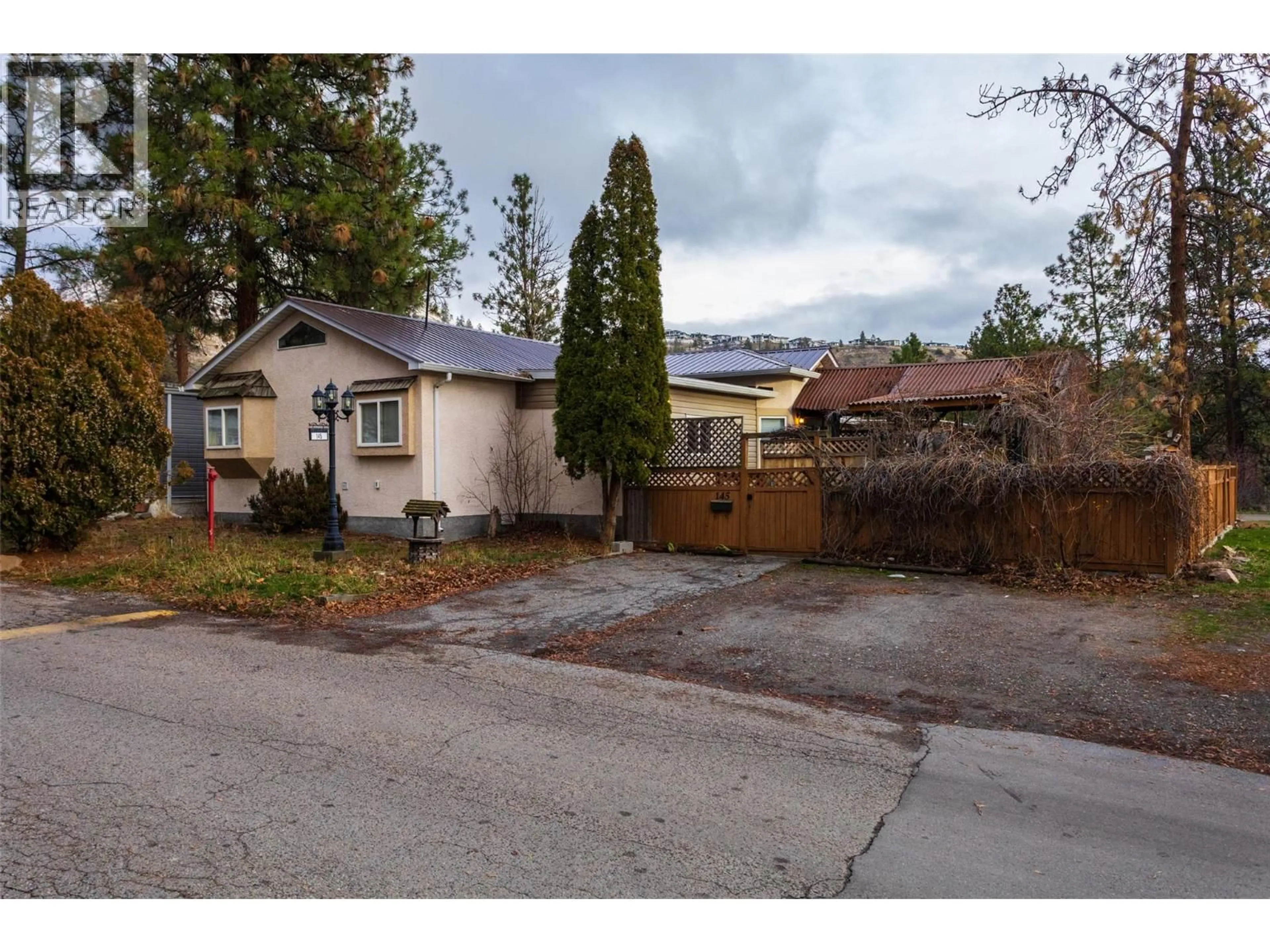 A pic from outside/outdoor area/front of a property/back of a property/a pic from drone, street for 145 - 1999 HIGHWAY 97 OTHER SOUTH, West Kelowna British Columbia V1Z1B2