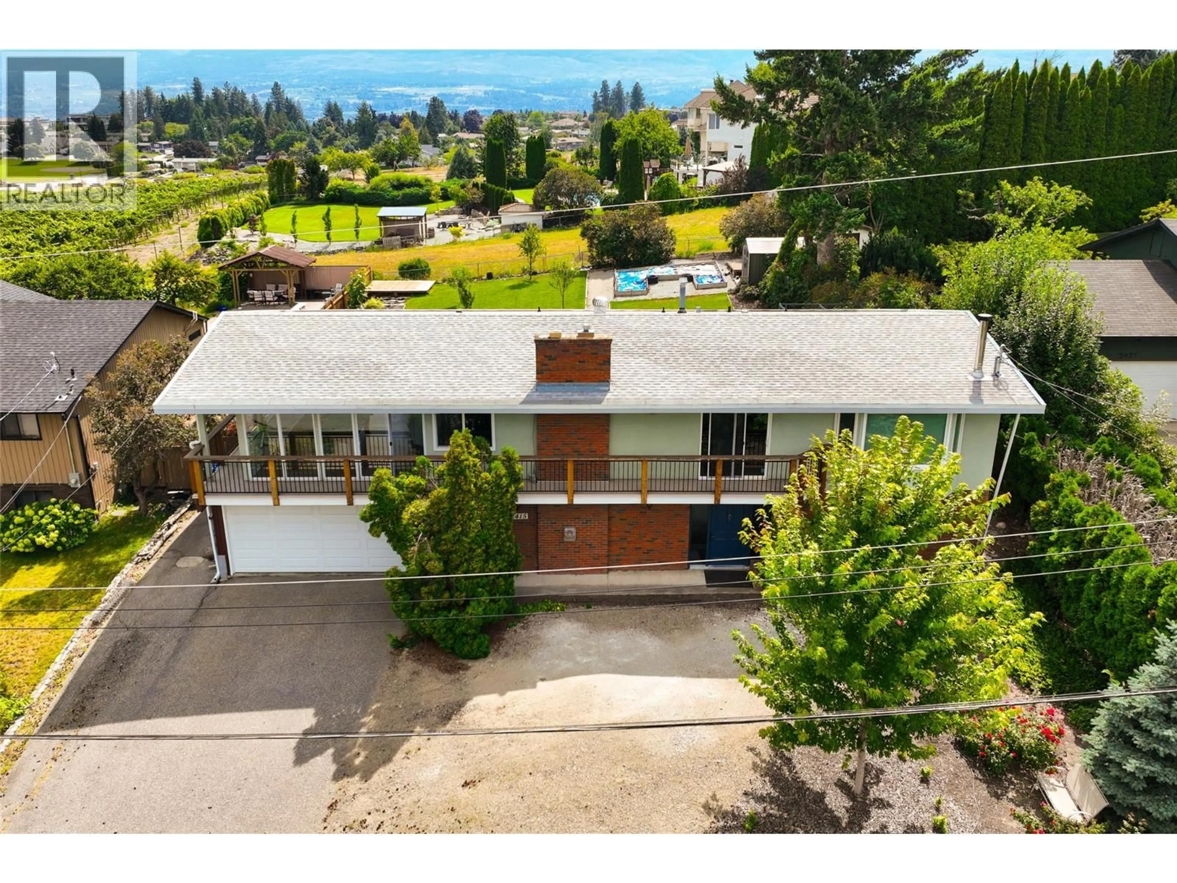 A pic from outside/outdoor area/front of a property/back of a property/a pic from drone, street for 2415 COLLINGWOOD ROAD, West Kelowna British Columbia V1Z2C3