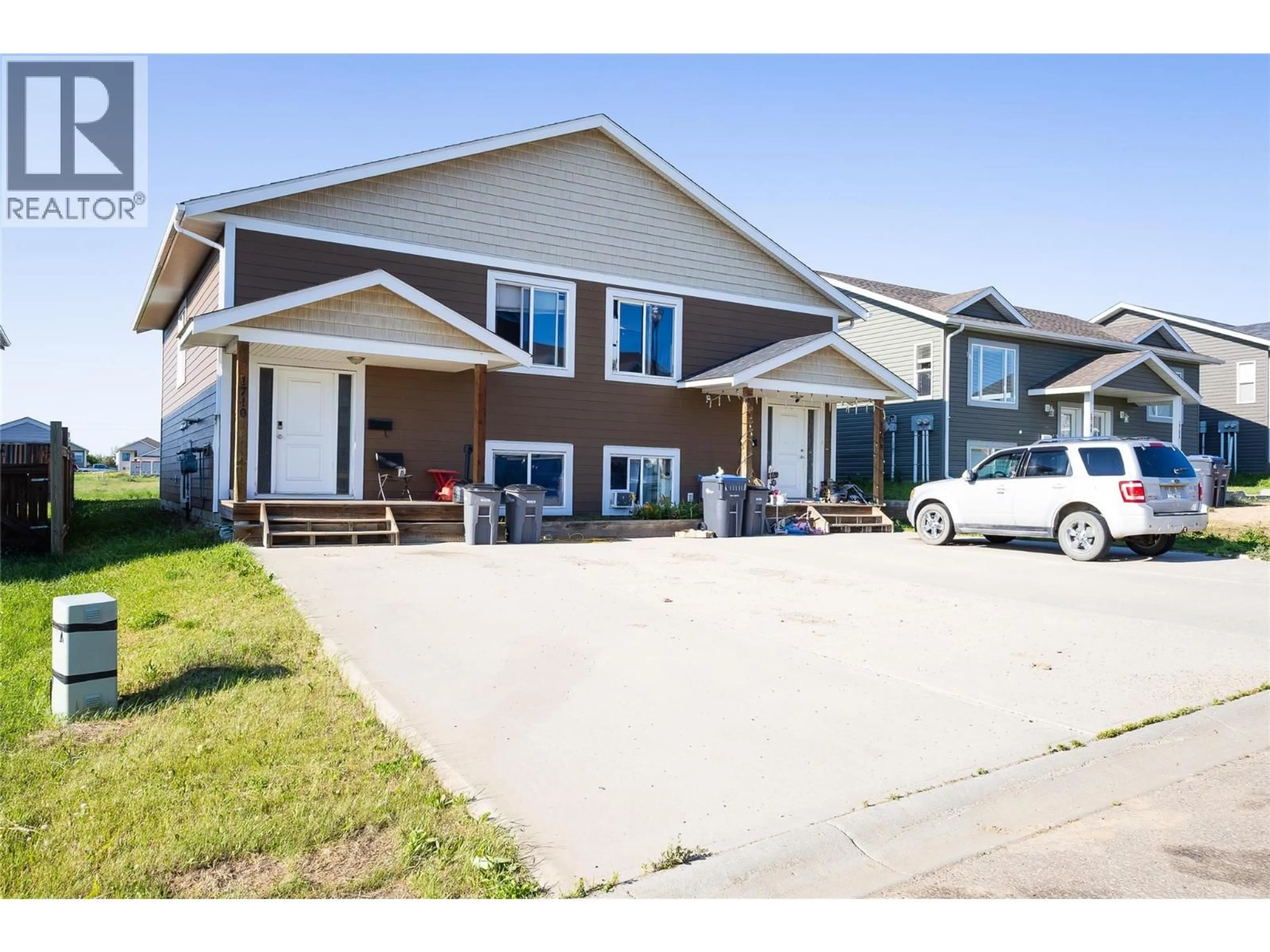 Home with vinyl exterior material, street for 1708 84 AVENUE, Dawson Creek British Columbia V1G3L5