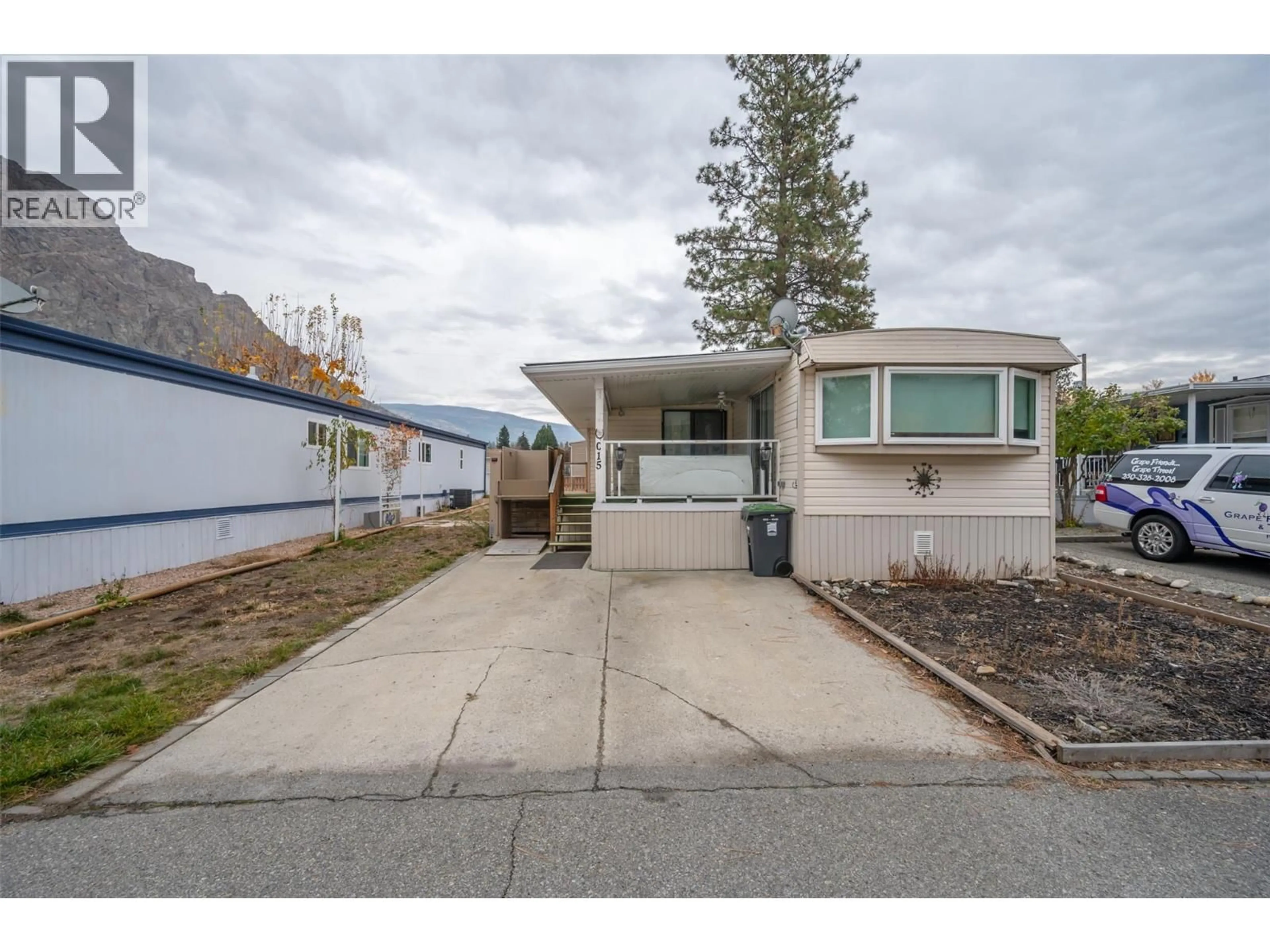 Home with vinyl exterior material, street for C15 - 4505 MCLEAN CREEK ROAD, Okanagan Falls British Columbia V0H1R1