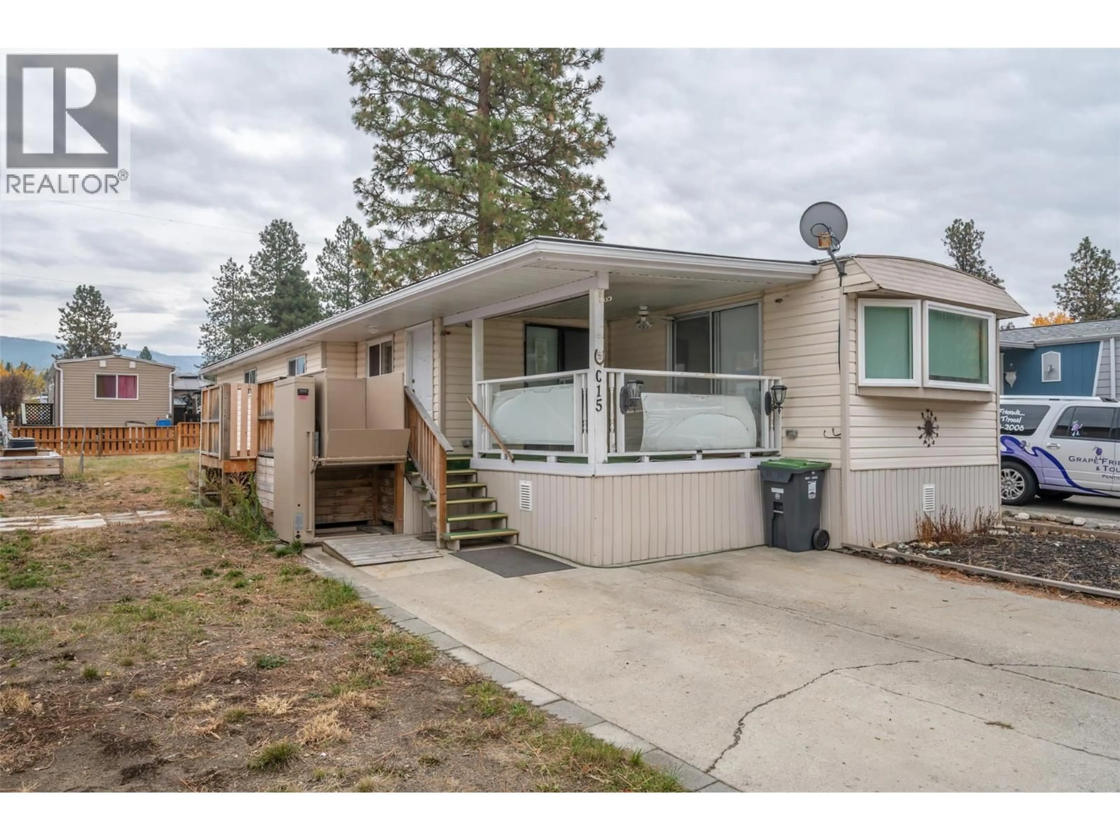 Home with vinyl exterior material, street for C15 - 4505 MCLEAN CREEK ROAD, Okanagan Falls British Columbia V0H1R1