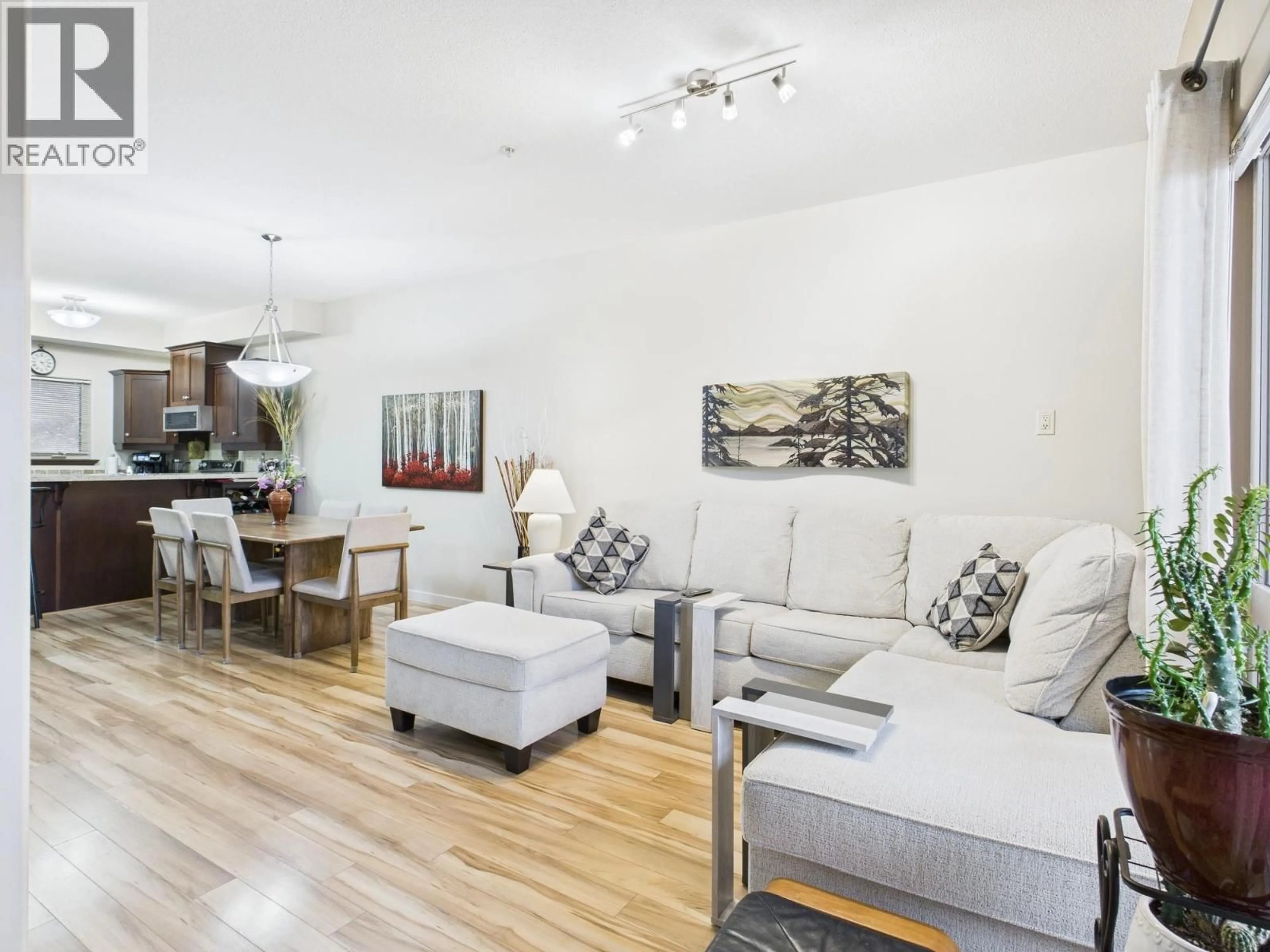 Living room with furniture, wood/laminate floor for 114 - 4300 44TH AVENUE, Osoyoos British Columbia V0H1V6