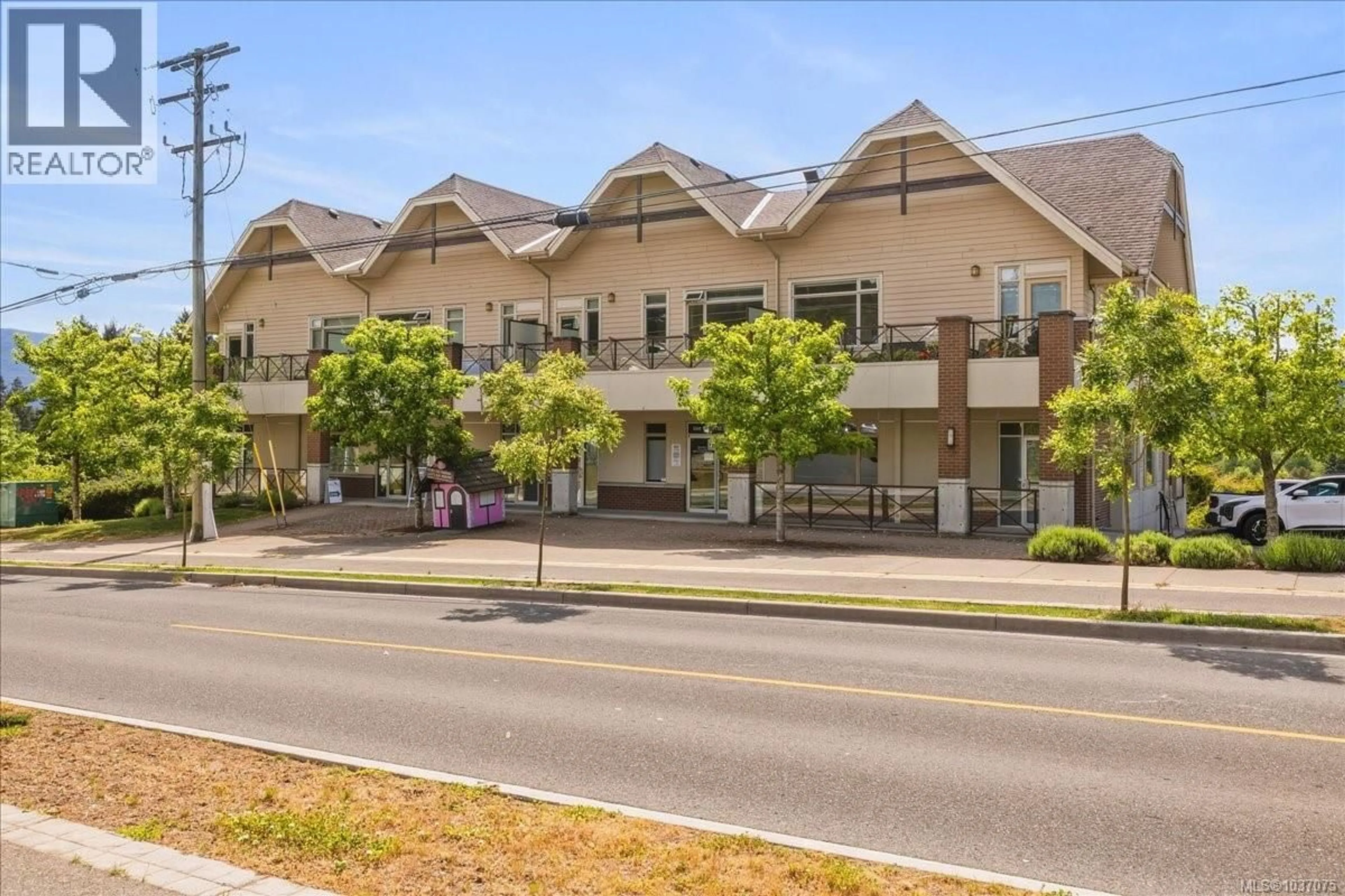 A pic from outside/outdoor area/front of a property/back of a property/a pic from drone, street for 202 - 6135 METRAL DRIVE, Nanaimo British Columbia V9T2L7