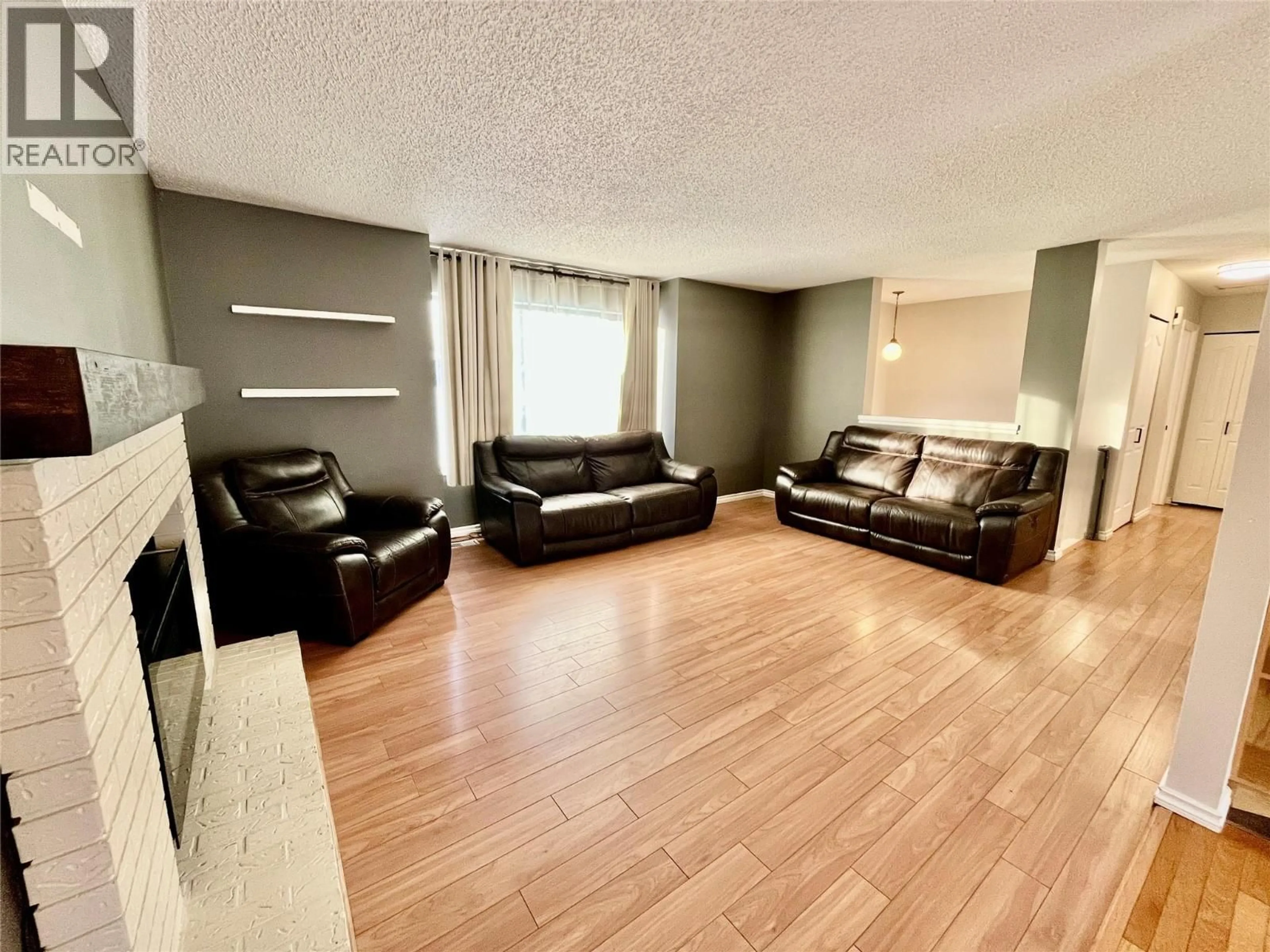 Living room with furniture, wood/laminate floor for 123 BERGERON DRIVE, Tumbler Ridge British Columbia V0C2W0