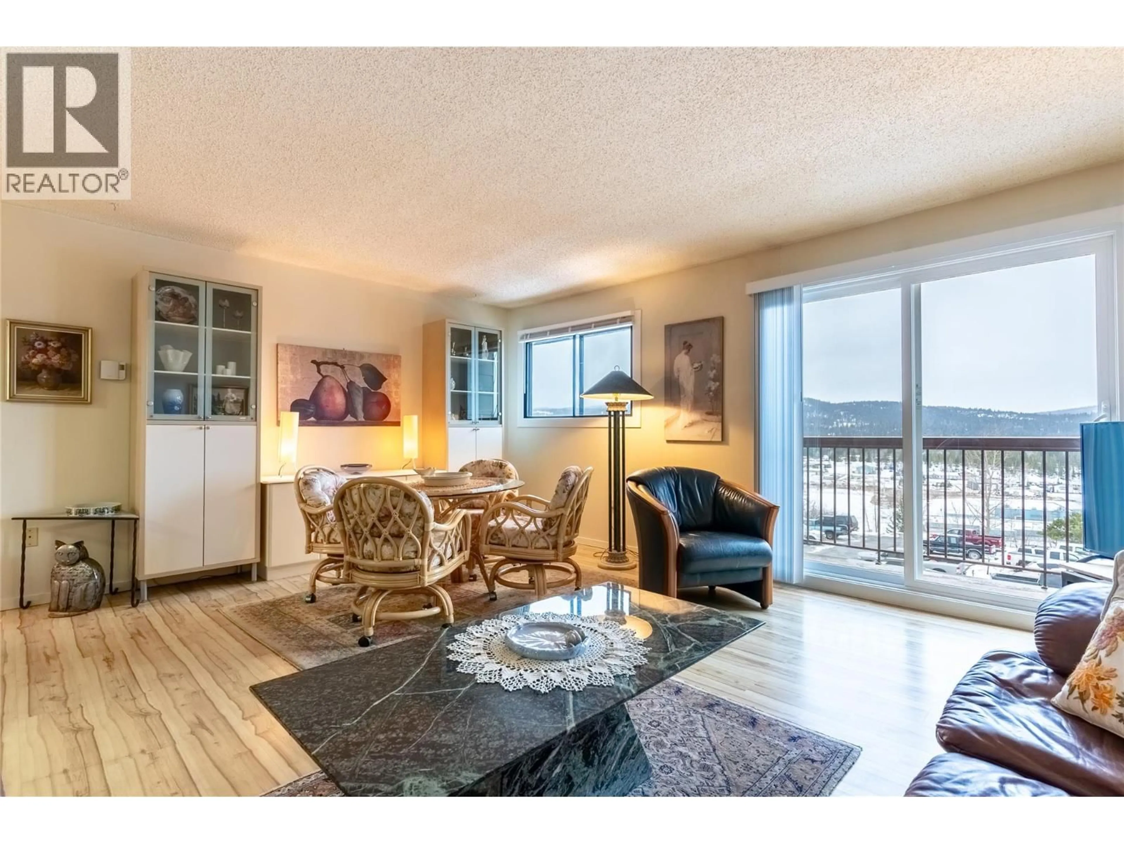 Living room with furniture, wood/laminate floor for 308 - 279 ALDER DRIVE, Logan Lake British Columbia V0K1W0