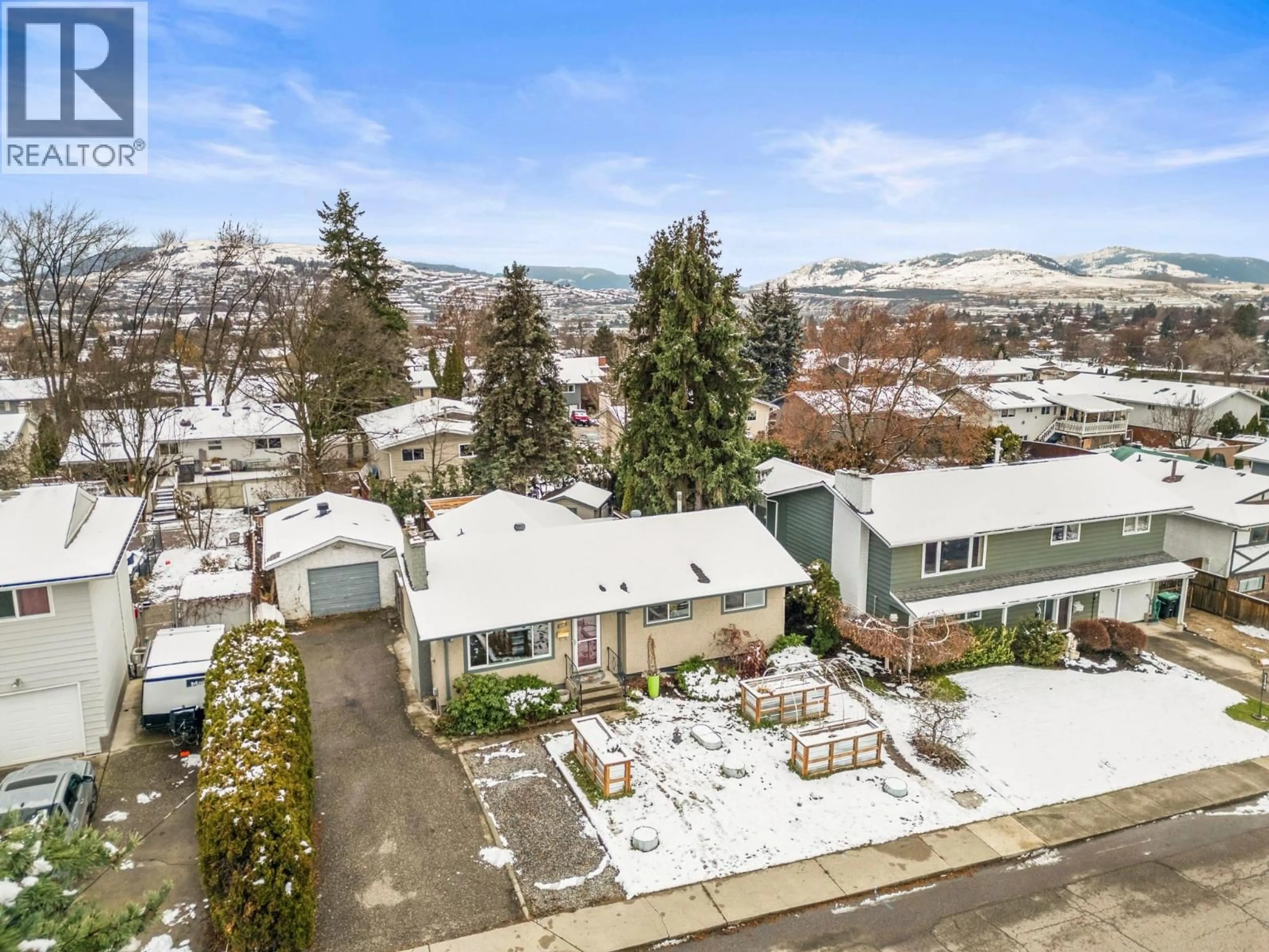 A pic from outside/outdoor area/front of a property/back of a property/a pic from drone, mountain view for 1016 34 AVENUE, Vernon British Columbia V1T6R9