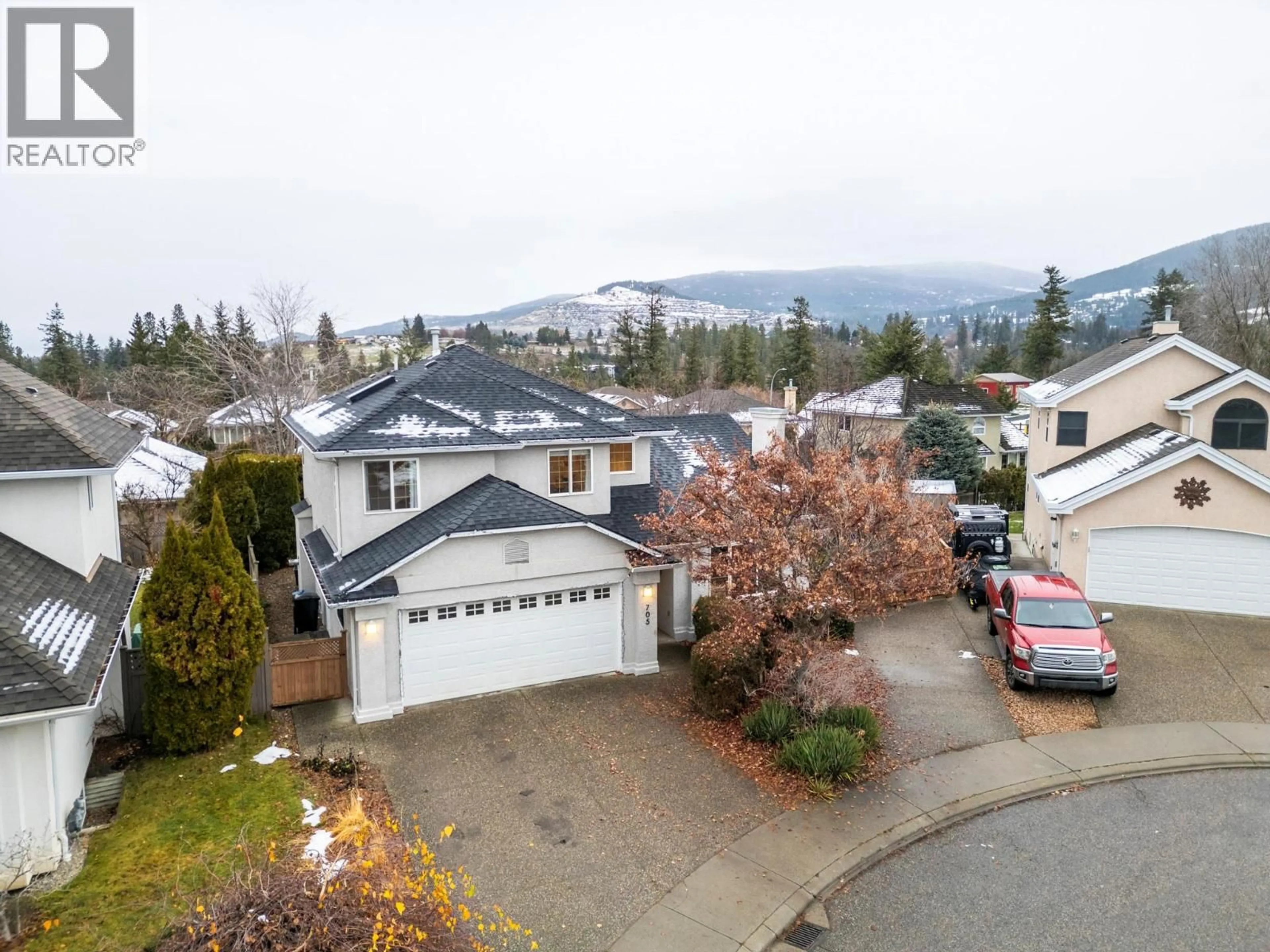 A pic from outside/outdoor area/front of a property/back of a property/a pic from drone, mountain view for 705 CAVALIER COURT, Vernon British Columbia V1T9M6