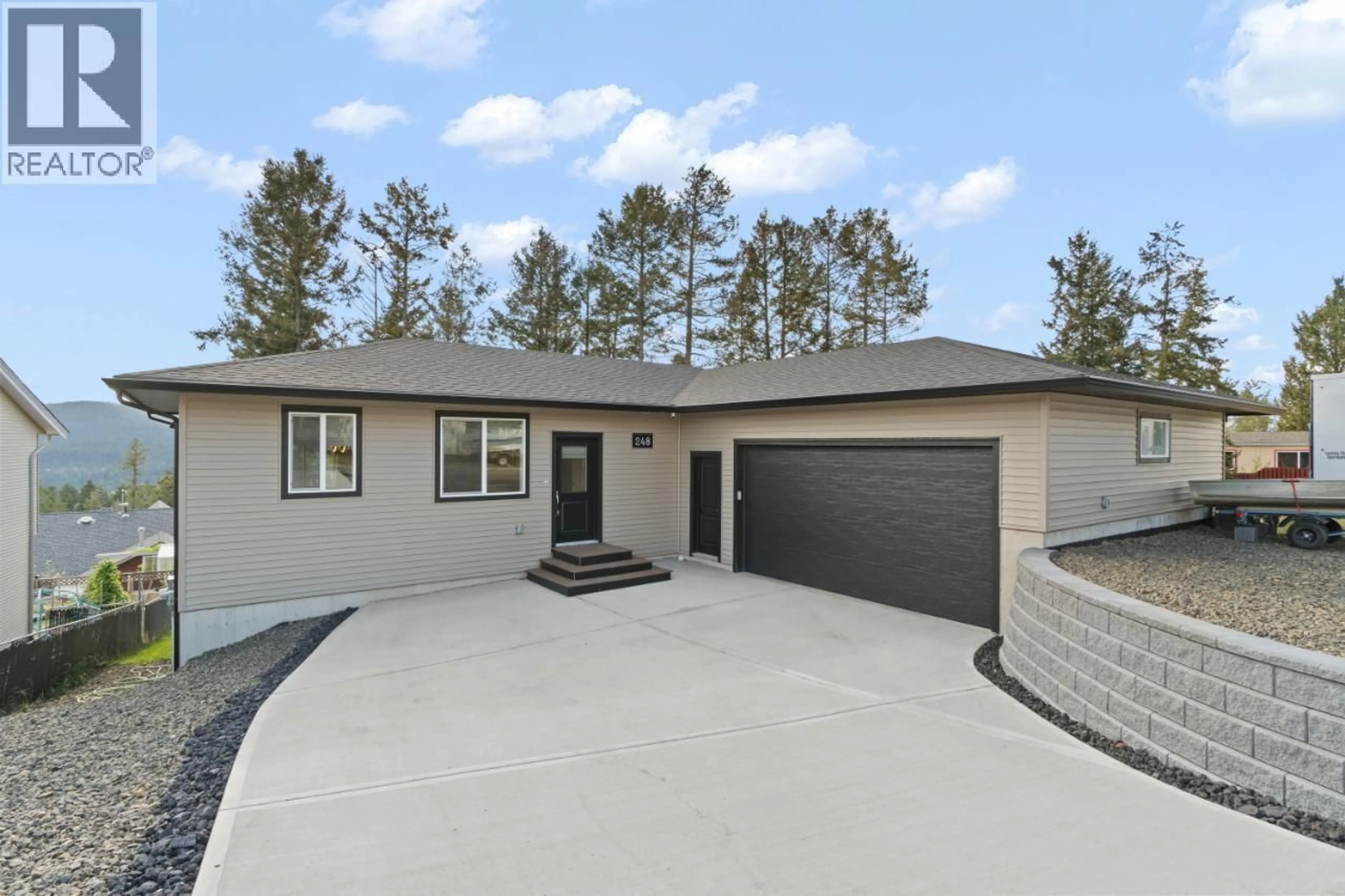 Home with vinyl exterior material, street for 248 CALCITE DRIVE, Logan Lake British Columbia V0K1W0