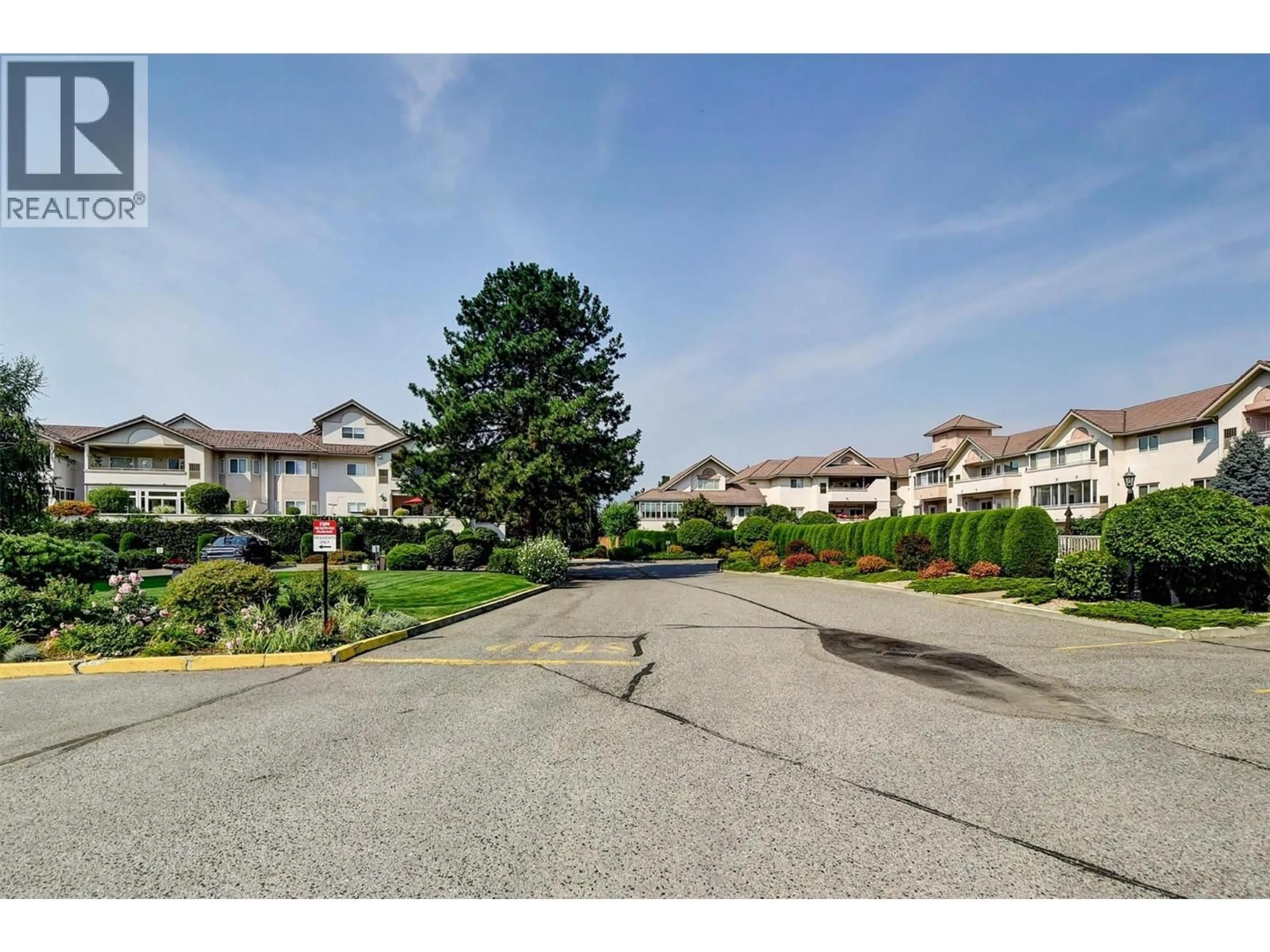 A pic from outside/outdoor area/front of a property/back of a property/a pic from drone, street for 202 - 2300 BENVOULIN ROAD, Kelowna British Columbia V1W2C6