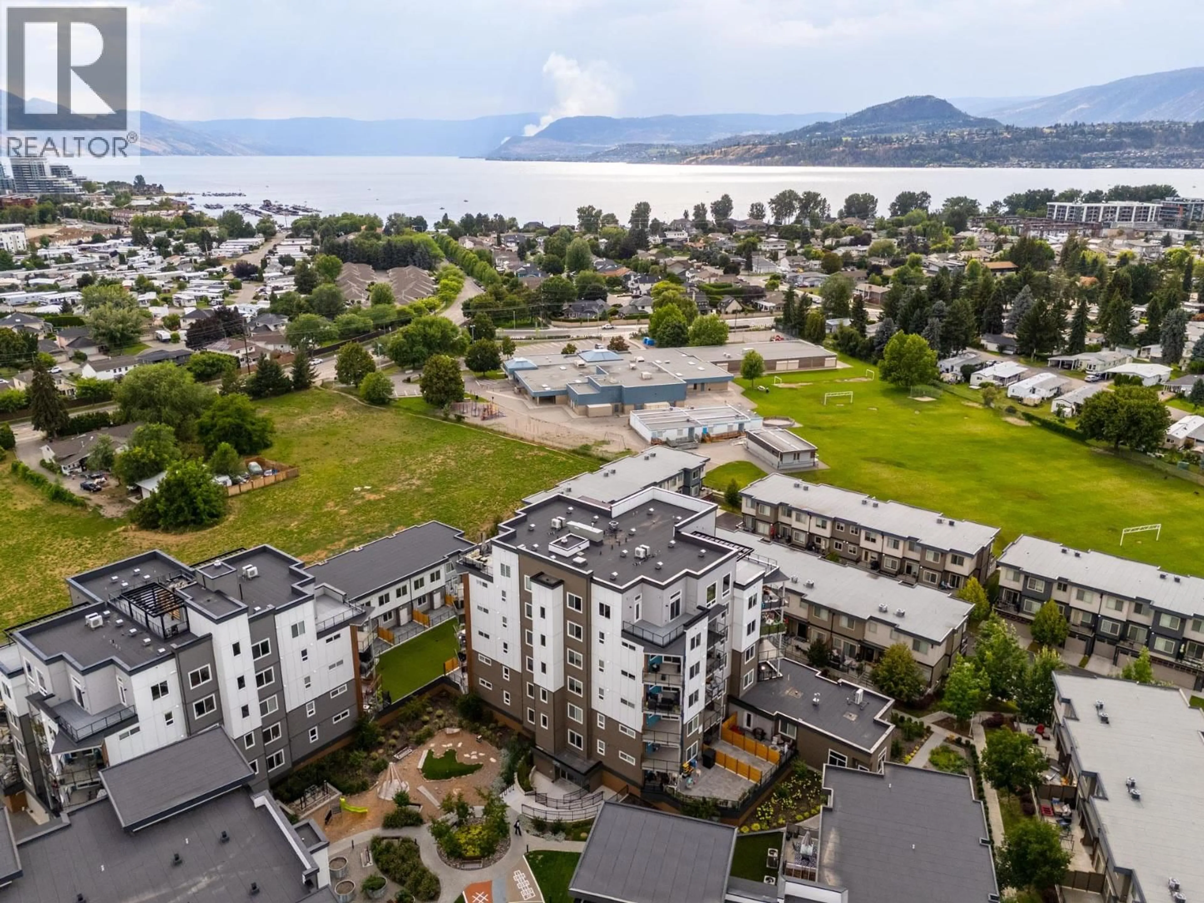 A pic from outside/outdoor area/front of a property/back of a property/a pic from drone, unknown for 405 - 3634 MISSION SPRINGS DRIVE, Kelowna British Columbia V1W0C9