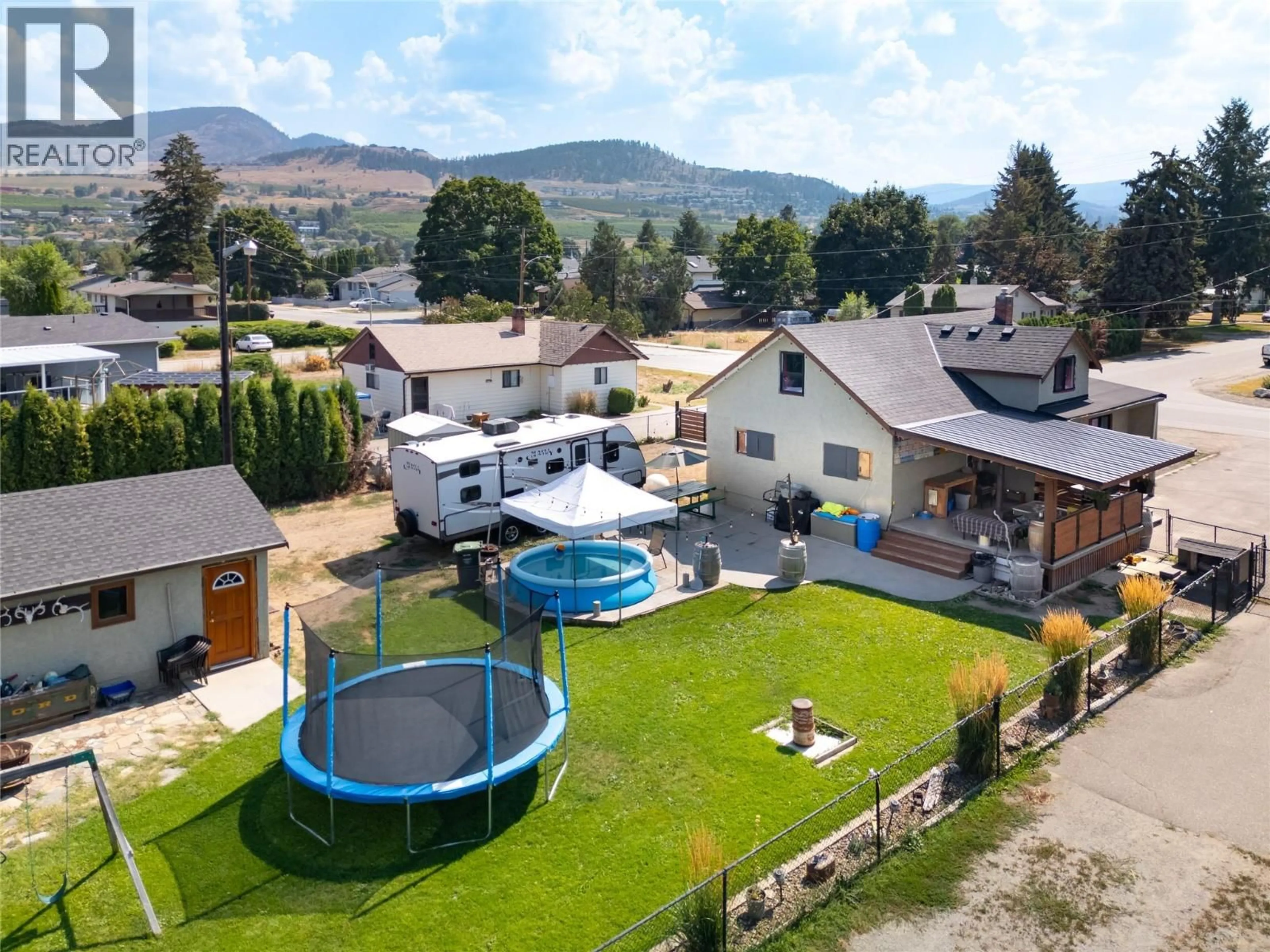 A pic from outside/outdoor area/front of a property/back of a property/a pic from drone, mountain view for 170 MUGFORD ROAD, Kelowna British Columbia V1X2E2